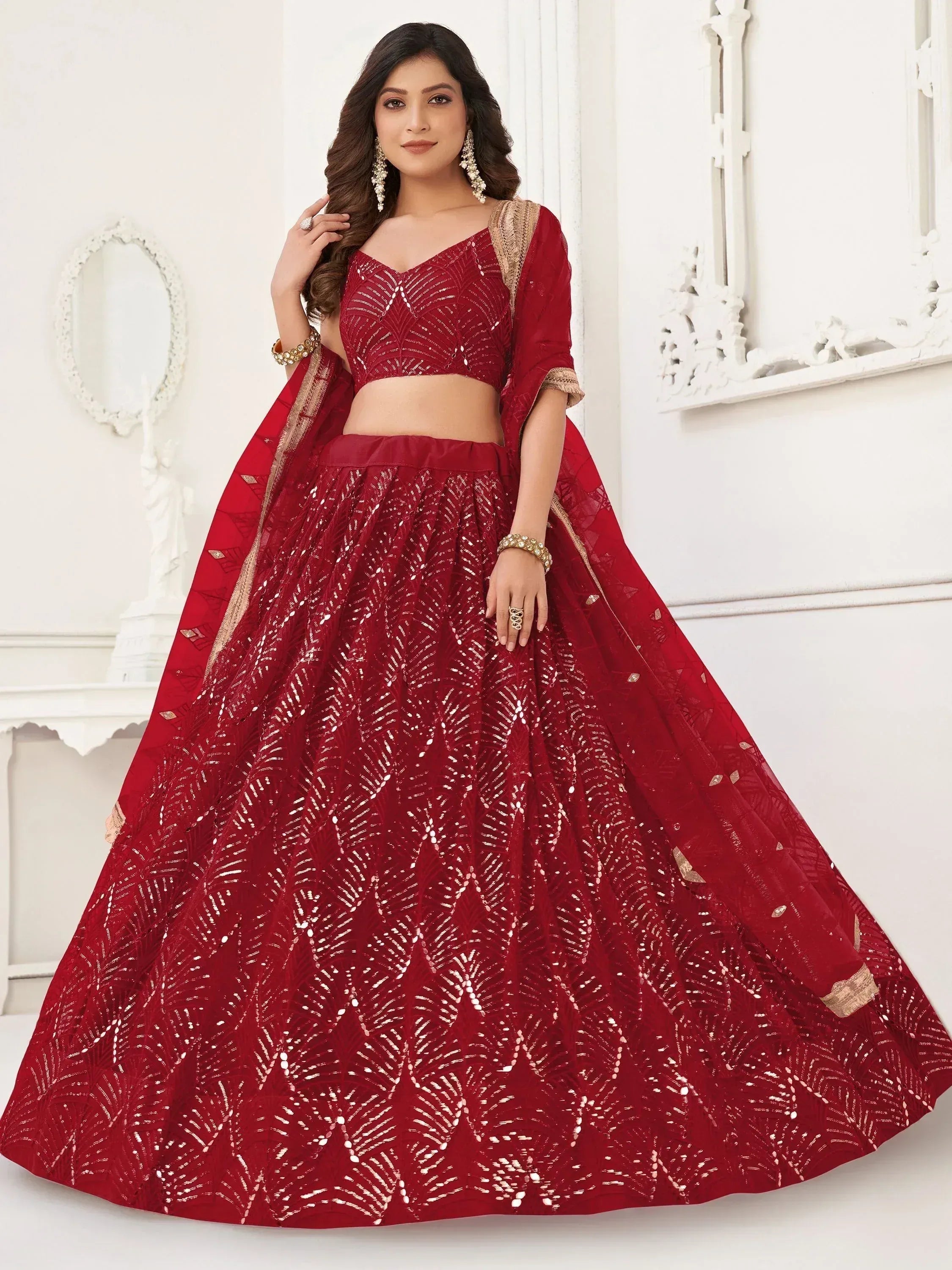Red designer lehenga choli with gold embroidery, perfect for weddings and festive occasions