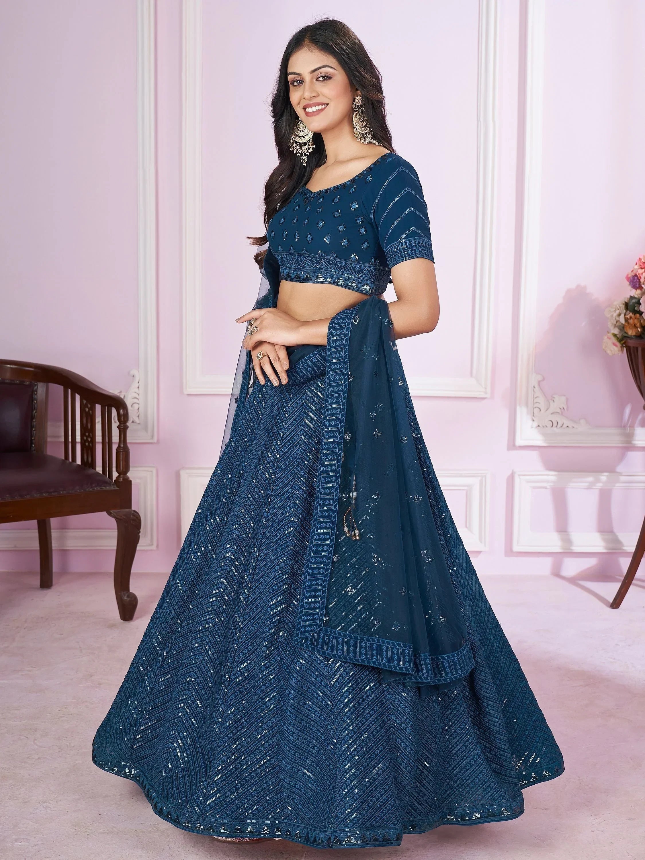 Elegant blue embroidered lehenga choli with intricate designs and matching dupatta for festive occasions
