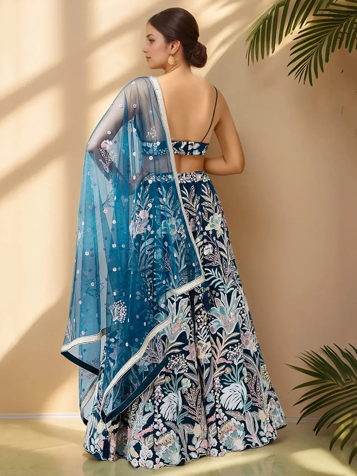 Elegant blue floral embroidered lehenga choli with sheer dupatta, perfect for Indian ethnic wear.