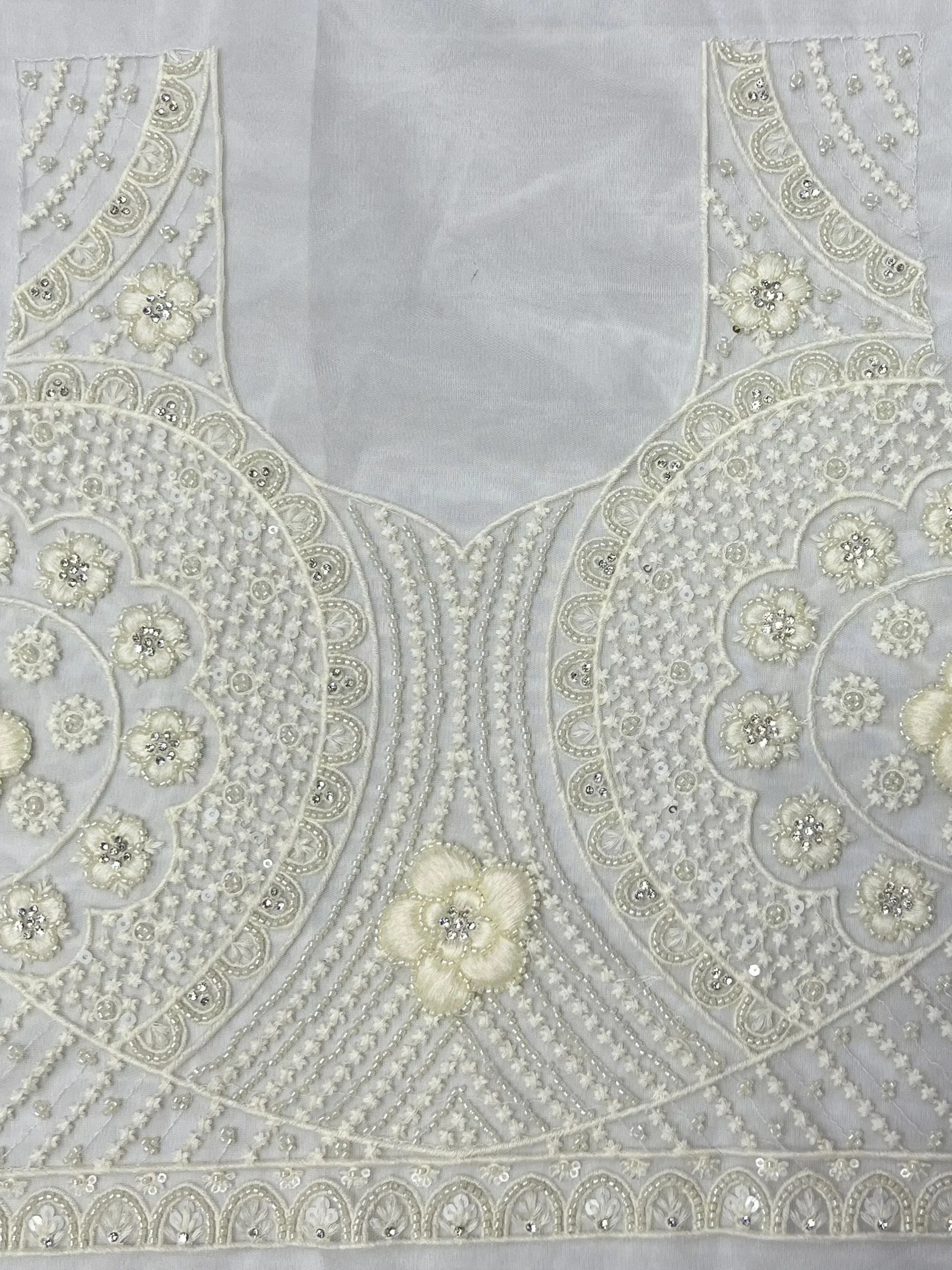 Elegant white ethnic blouse with intricate floral embroidery and sequin detailing for lehenga choli
