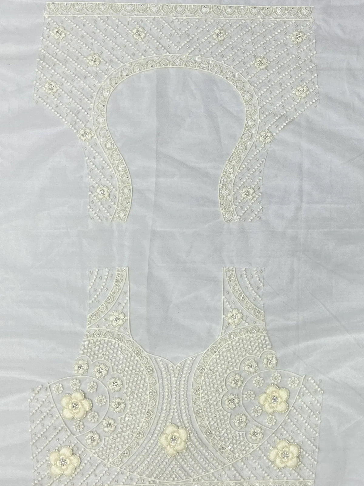 White embroidered lehenga choli blouse with floral beadwork and pearl detailing for Indian ethnic wear