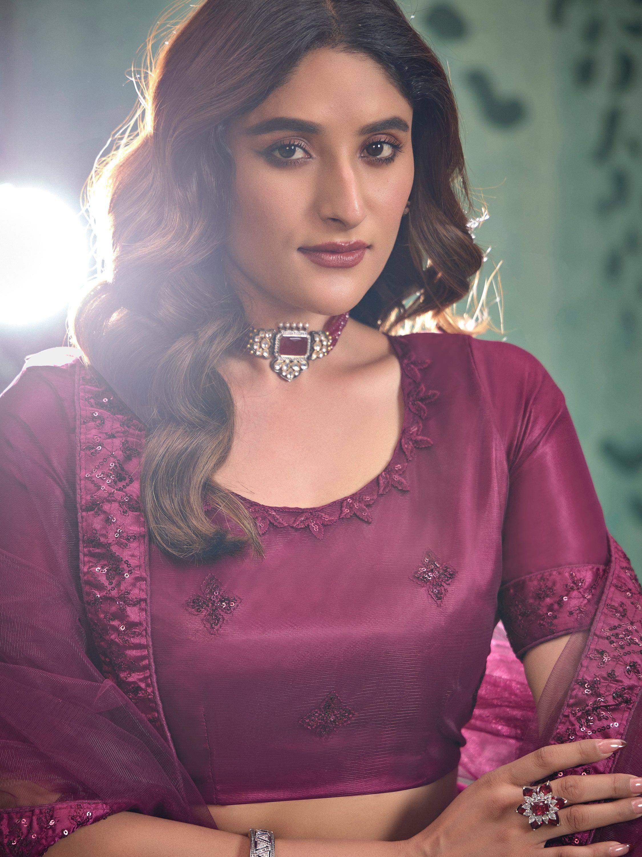 Elegant maroon ethnic blouse with sequin embroidery and matching jewelry for Indian wear