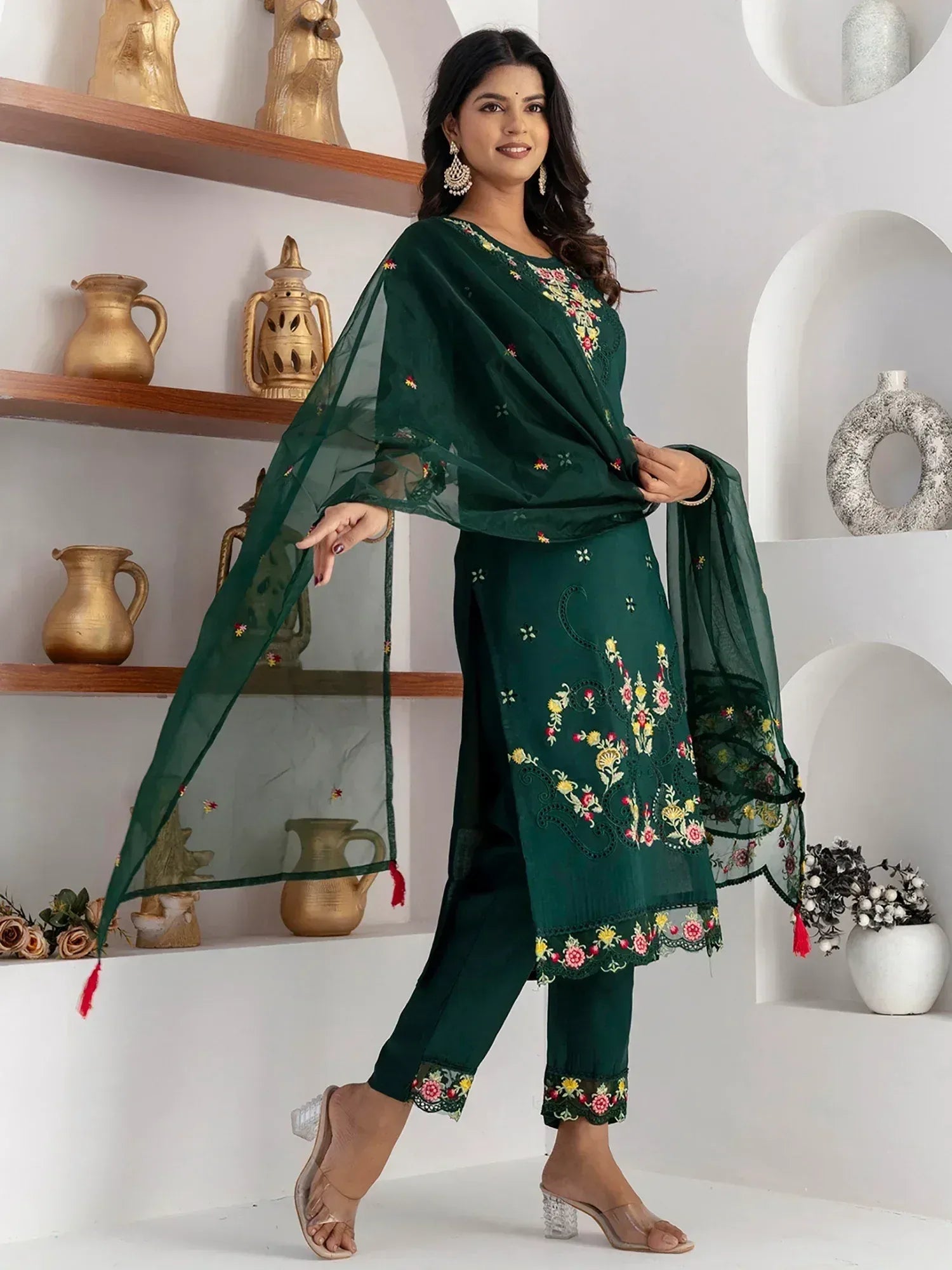 Emerald green embroidered salwar kameez with floral motifs and sheer dupatta, ideal for Indian ethnic wear.