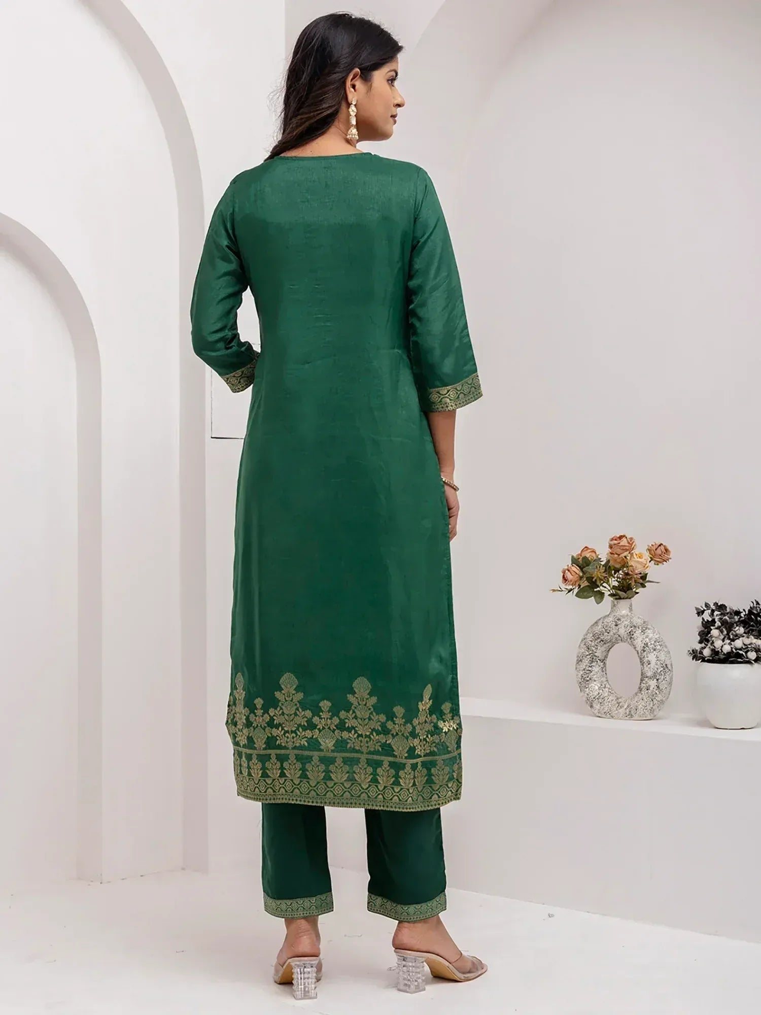 Emerald green ethnic kurta with gold embroidery, paired with matching pants, ideal for Indian occasions