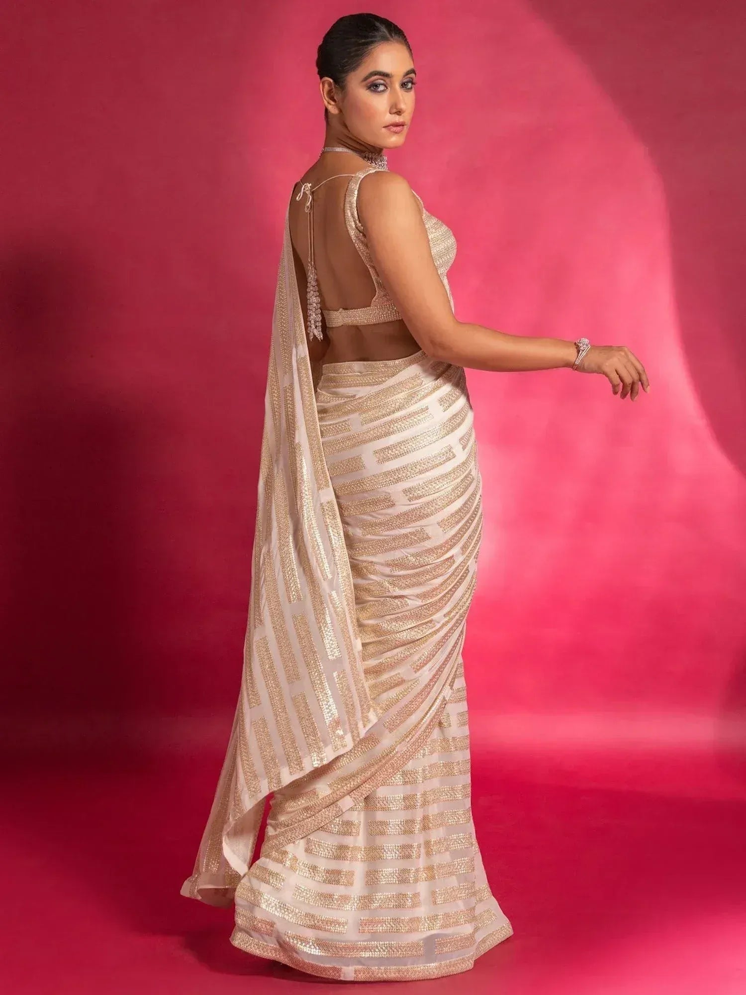 Elegant gold and ivory saree with geometric sequin design, backless blouse, perfect for Indian ethnic occasions