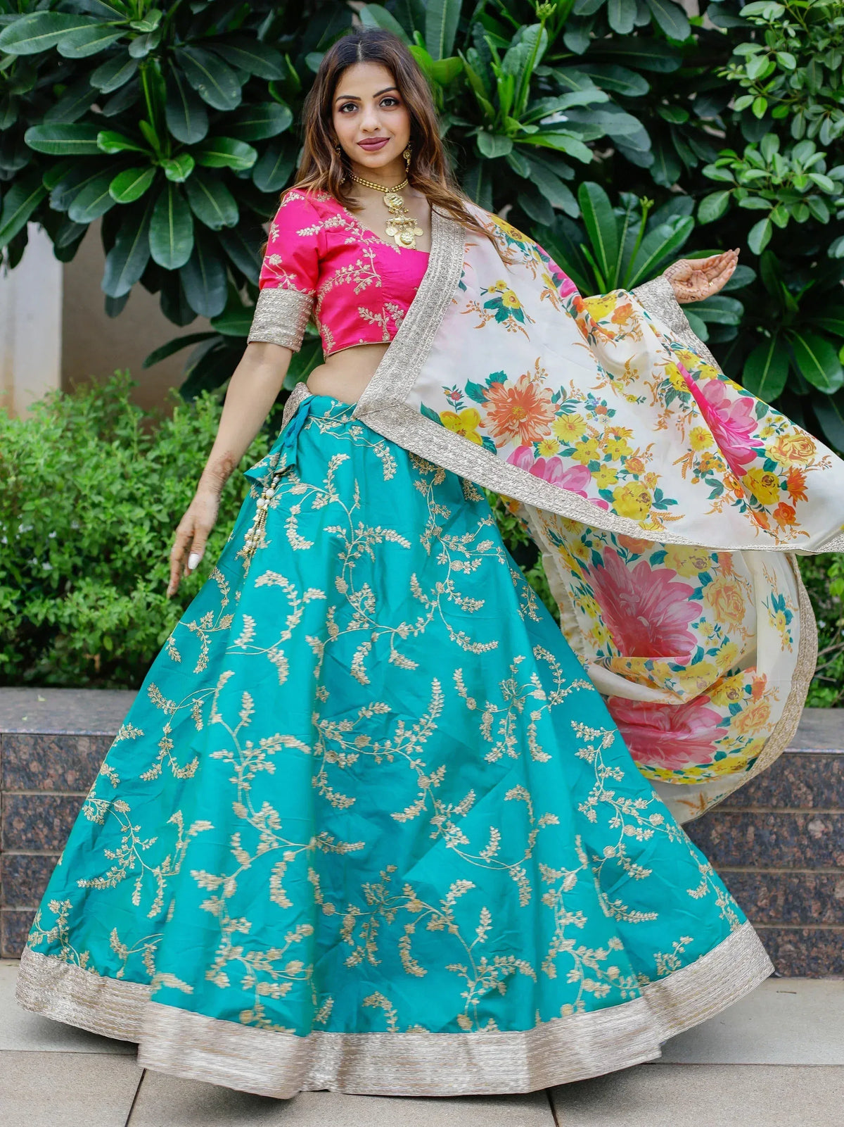 Turquoise lehenga with gold embroidery, pink blouse, floral dupatta - Indian ethnic wear