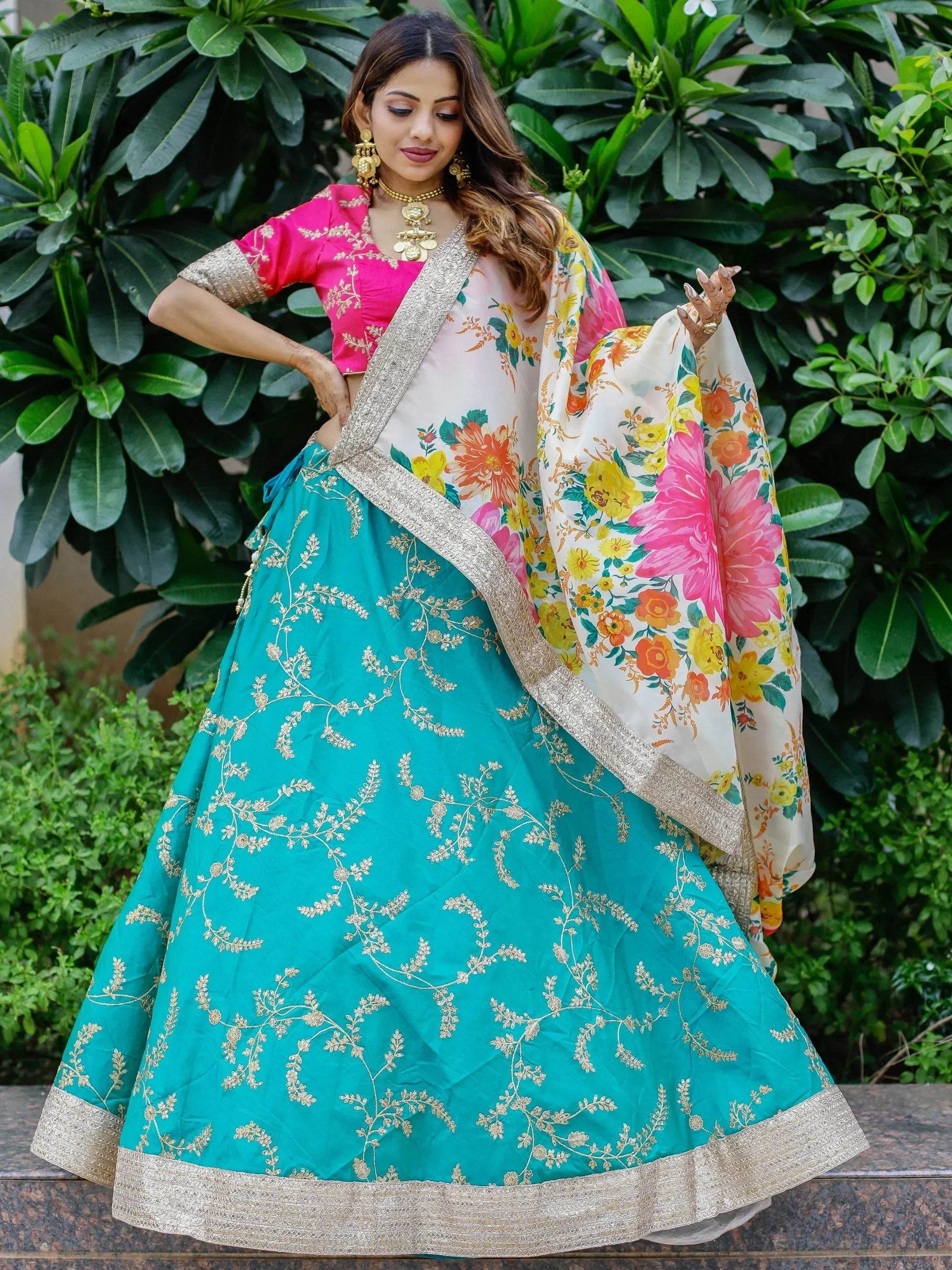 Teal lehenga with gold embroidery, pink blouse, floral dupatta — Indian ethnic wear