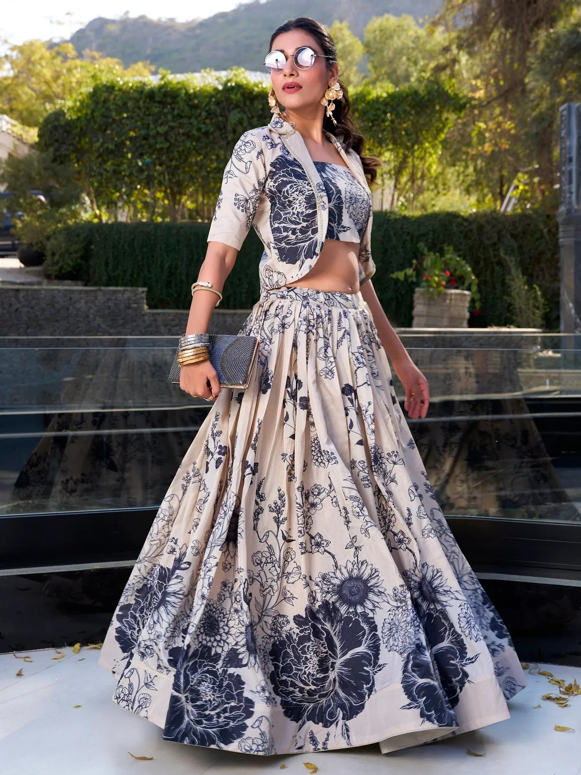 Woman in floral print lehenga choli with jacket, ethnic wear for weddings and parties