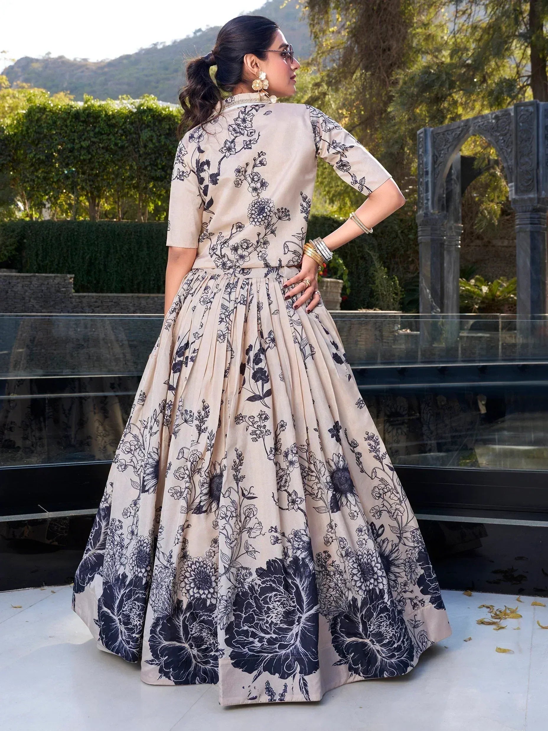 Beige floral print ethnic gown with black botanical design, perfect for Indian occasions