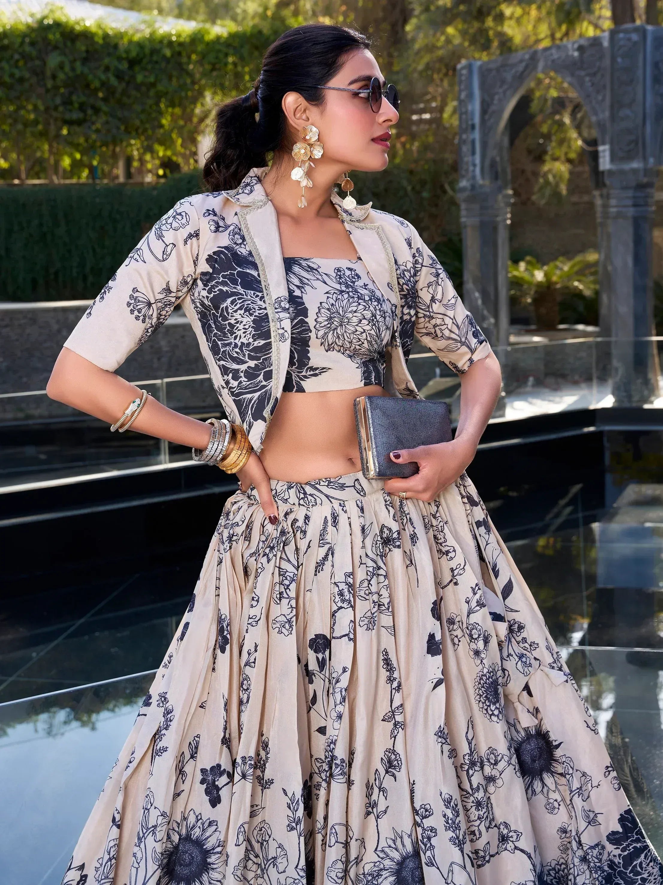 Woman in floral print lehenga choli with matching jacket, perfect for Indian ethnic occasions