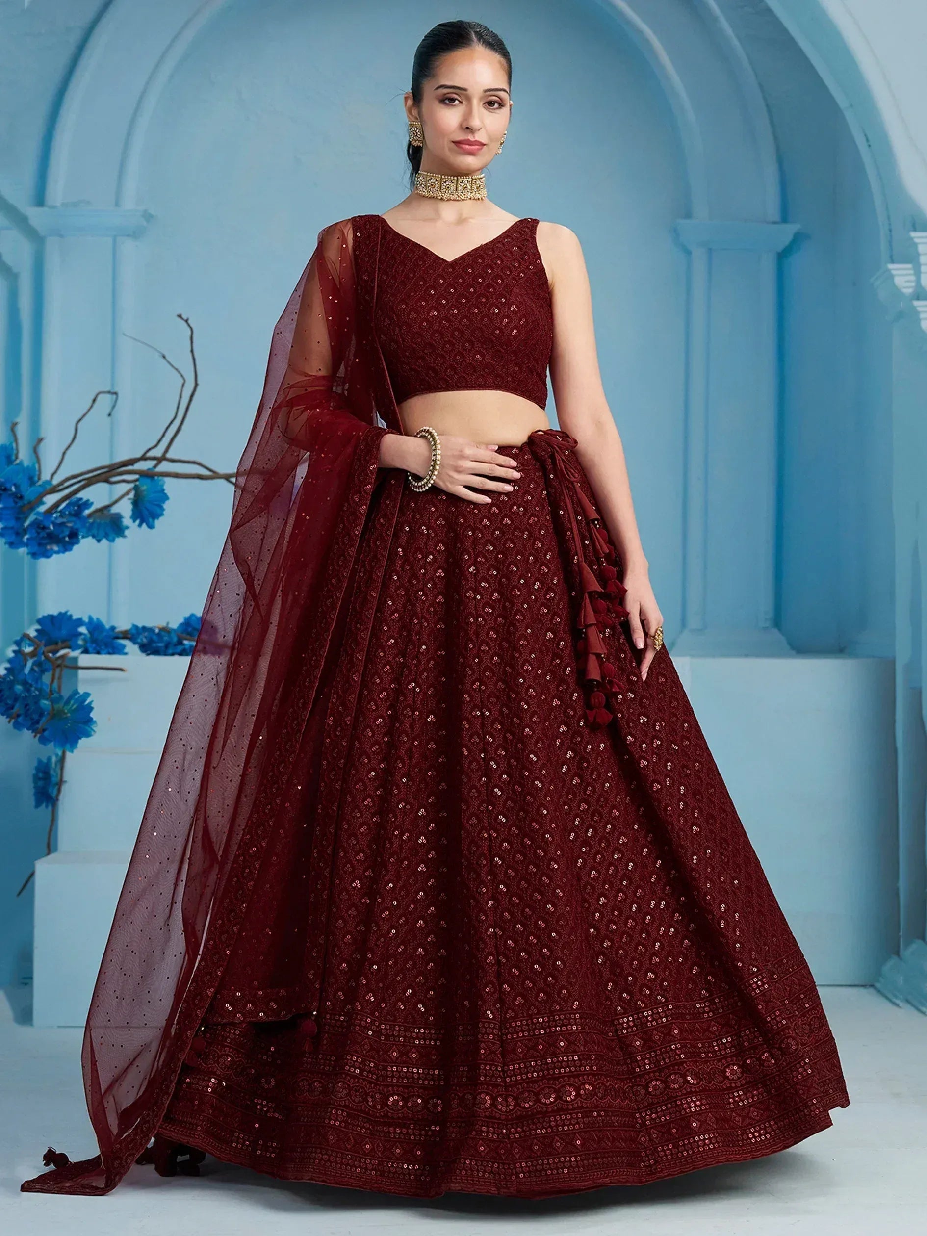 Maroon sequin lehenga choli with sheer dupatta, perfect for Indian weddings and festive occasions