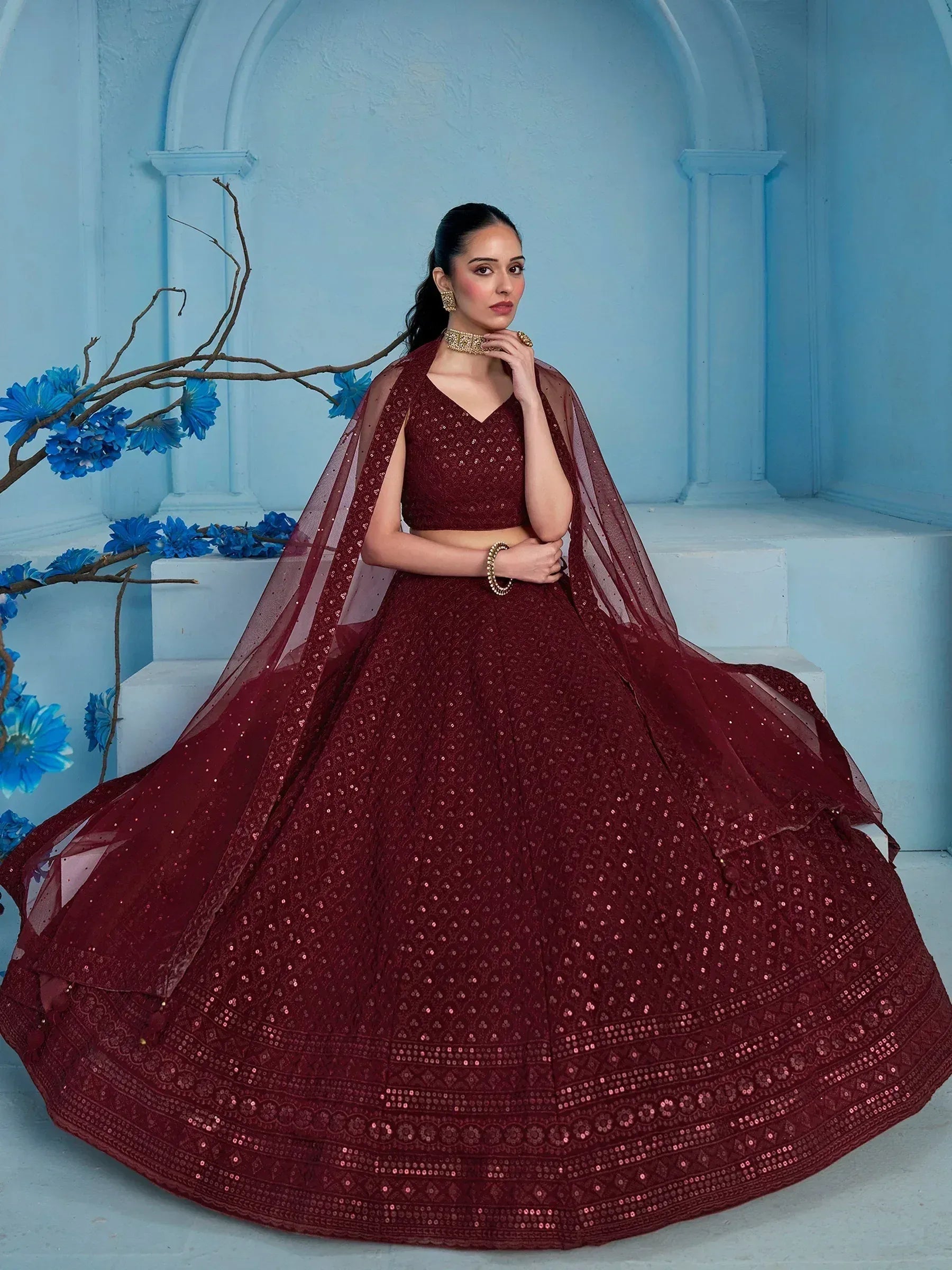 Maroon sequin lehenga choli with sheer dupatta, perfect for Indian weddings and festive occasions.