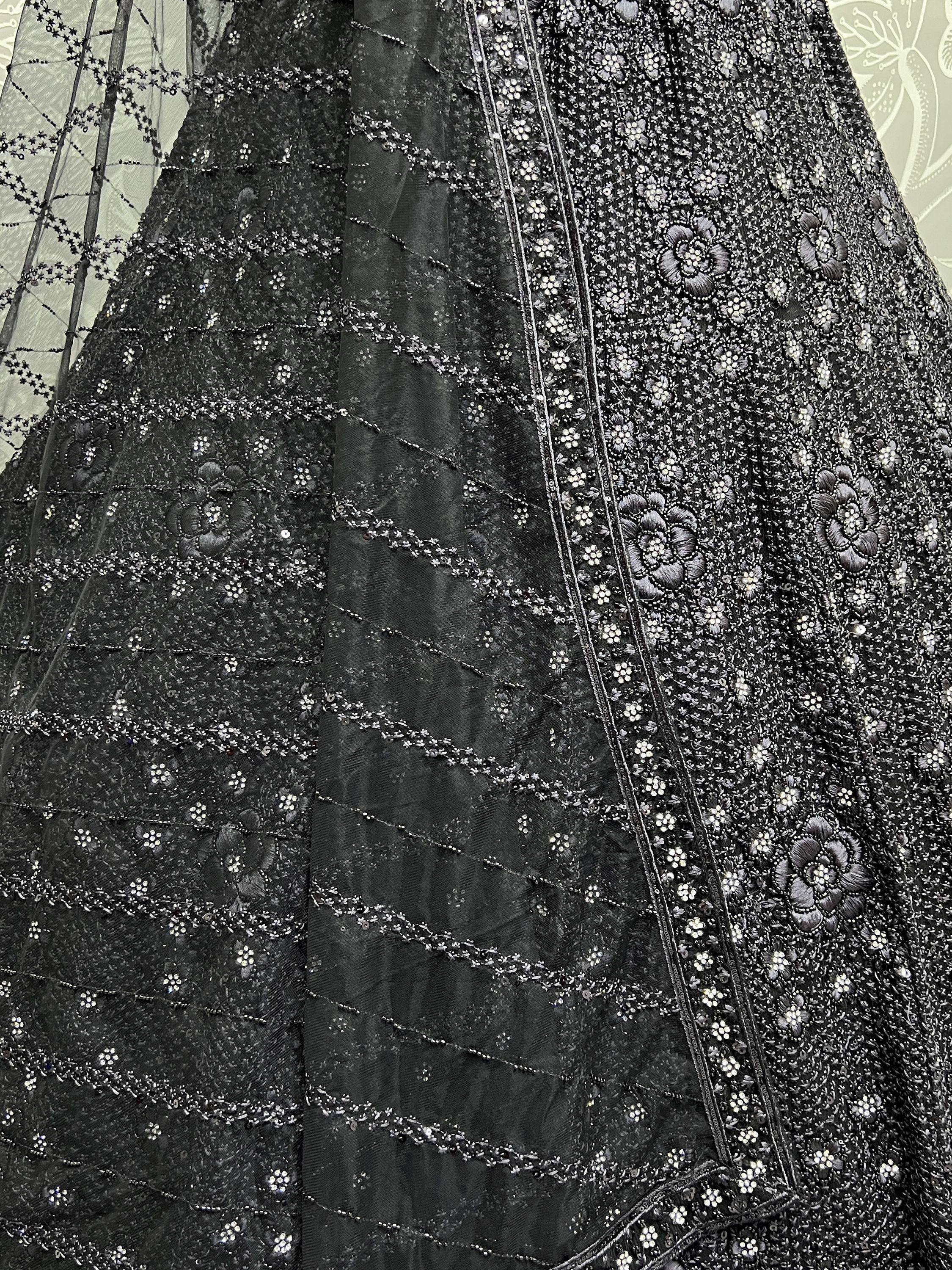 Black designer lehenga with intricate floral embroidery and sequin detailing for ethnic wear