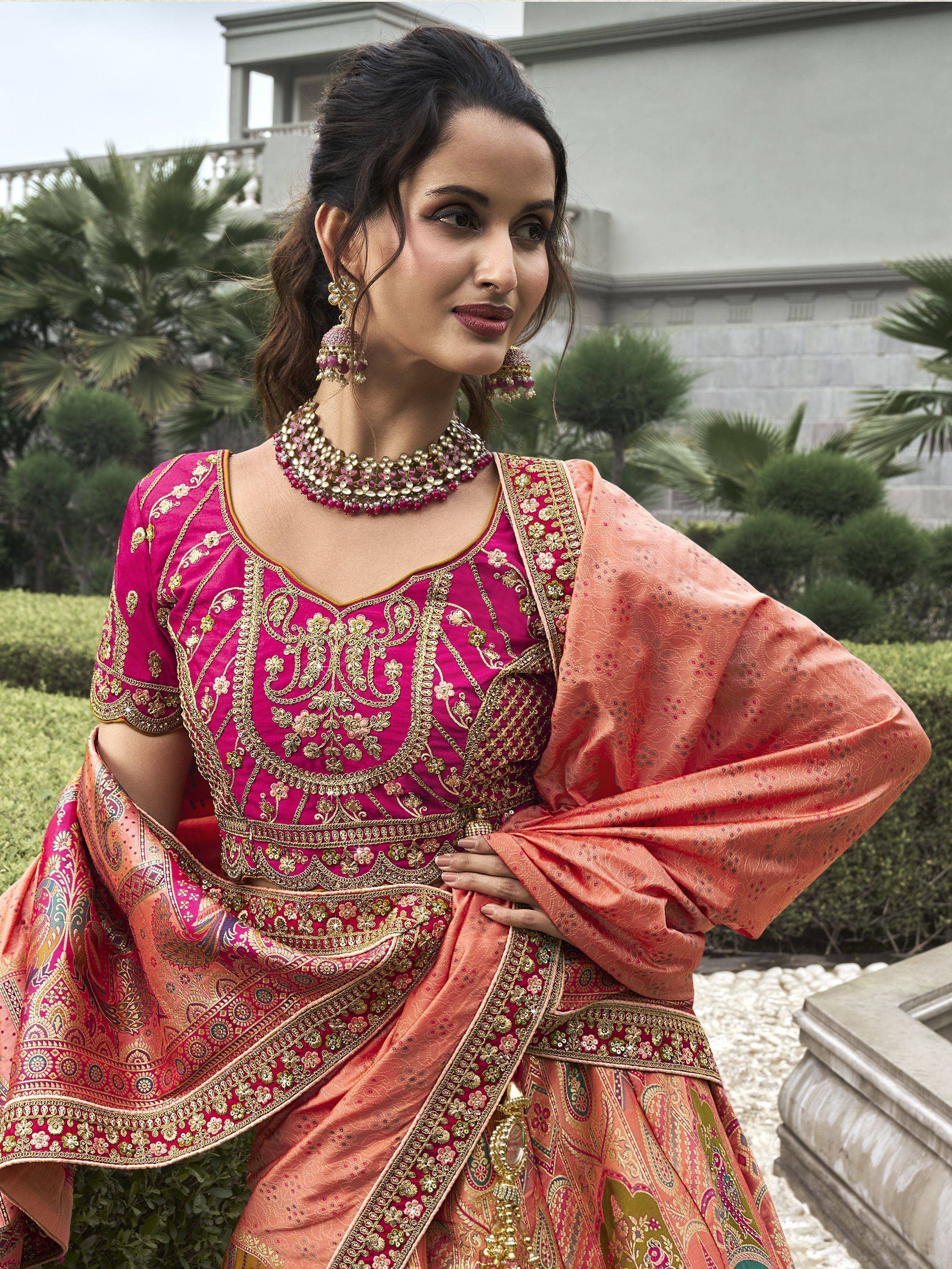 Elegant pink and peach Indian ethnic lehenga choli with gold embroidery, perfect for weddings and festivals.