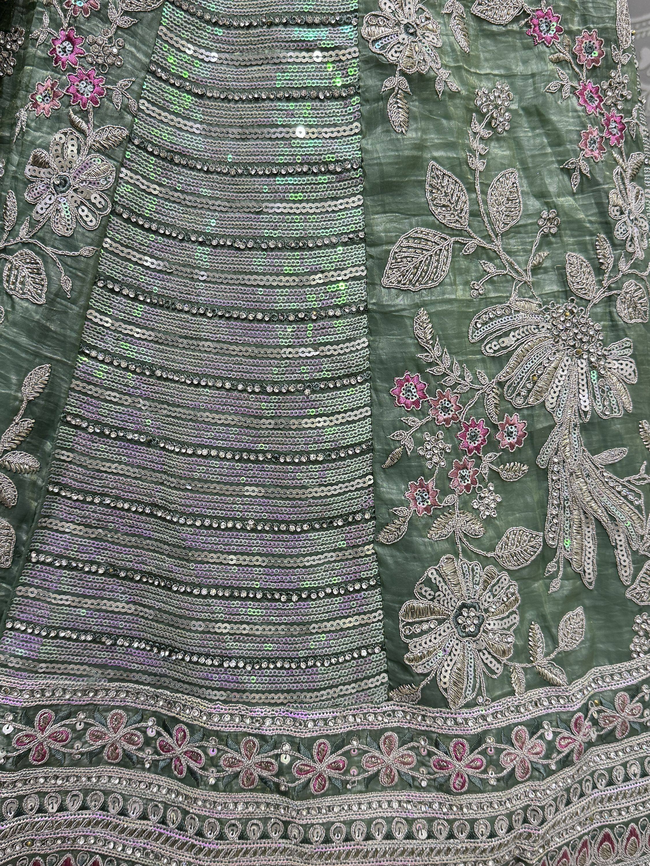 Green ethnic gown with floral embroidery and sequin detailing for Indian wear