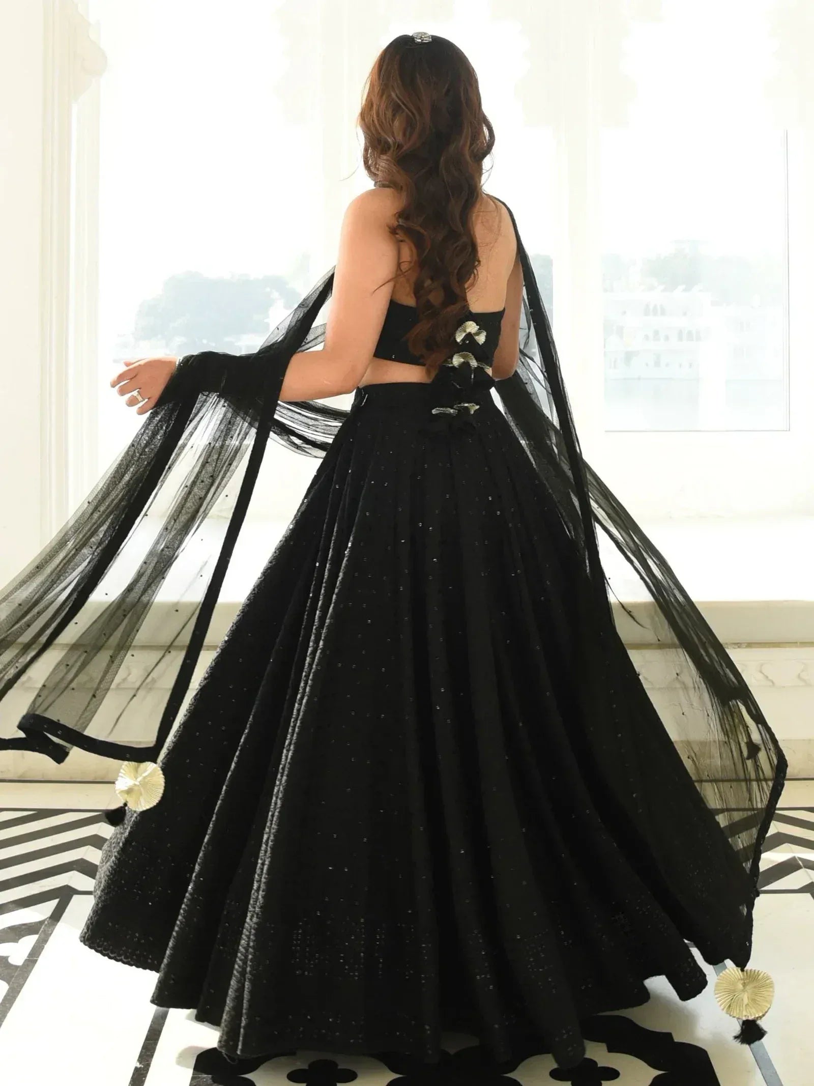 Black sequined lehenga choli with sheer dupatta, elegant ethnic wear for women