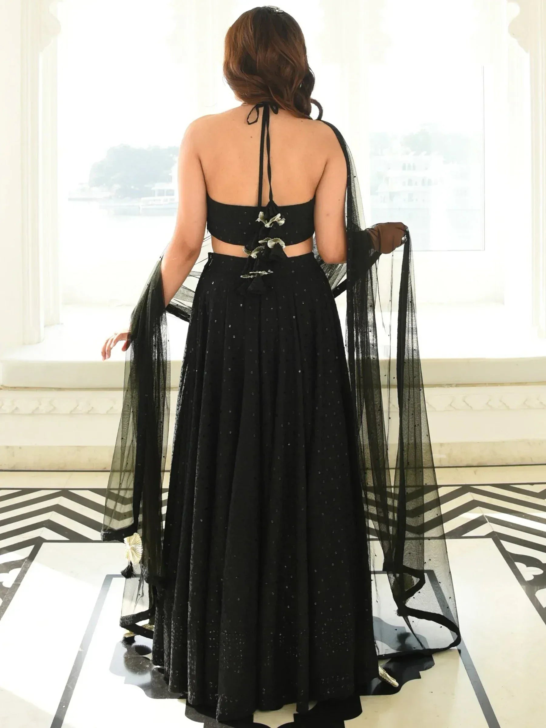 Black sequined lehenga choli with sheer dupatta, back view, ethnic wear for women