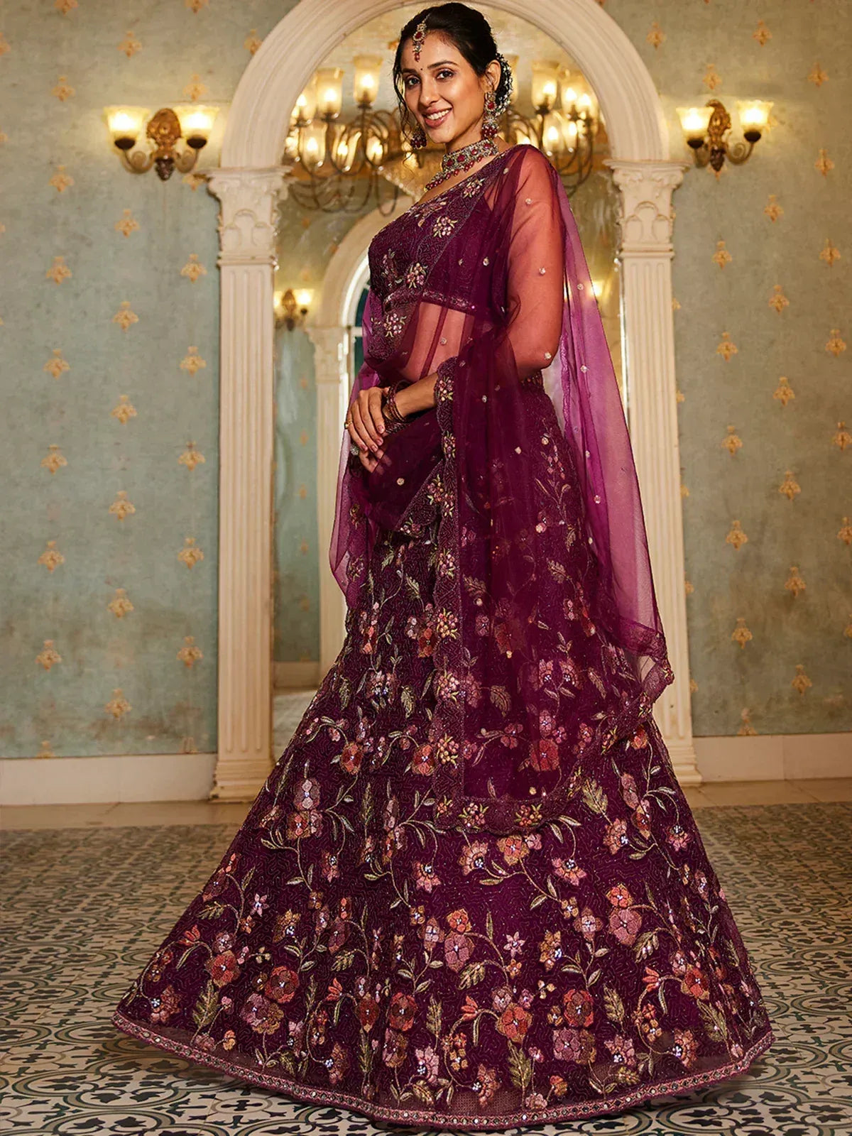 Elegant purple floral embroidered lehenga choli with sheer dupatta, perfect for Indian weddings and festive occasions.