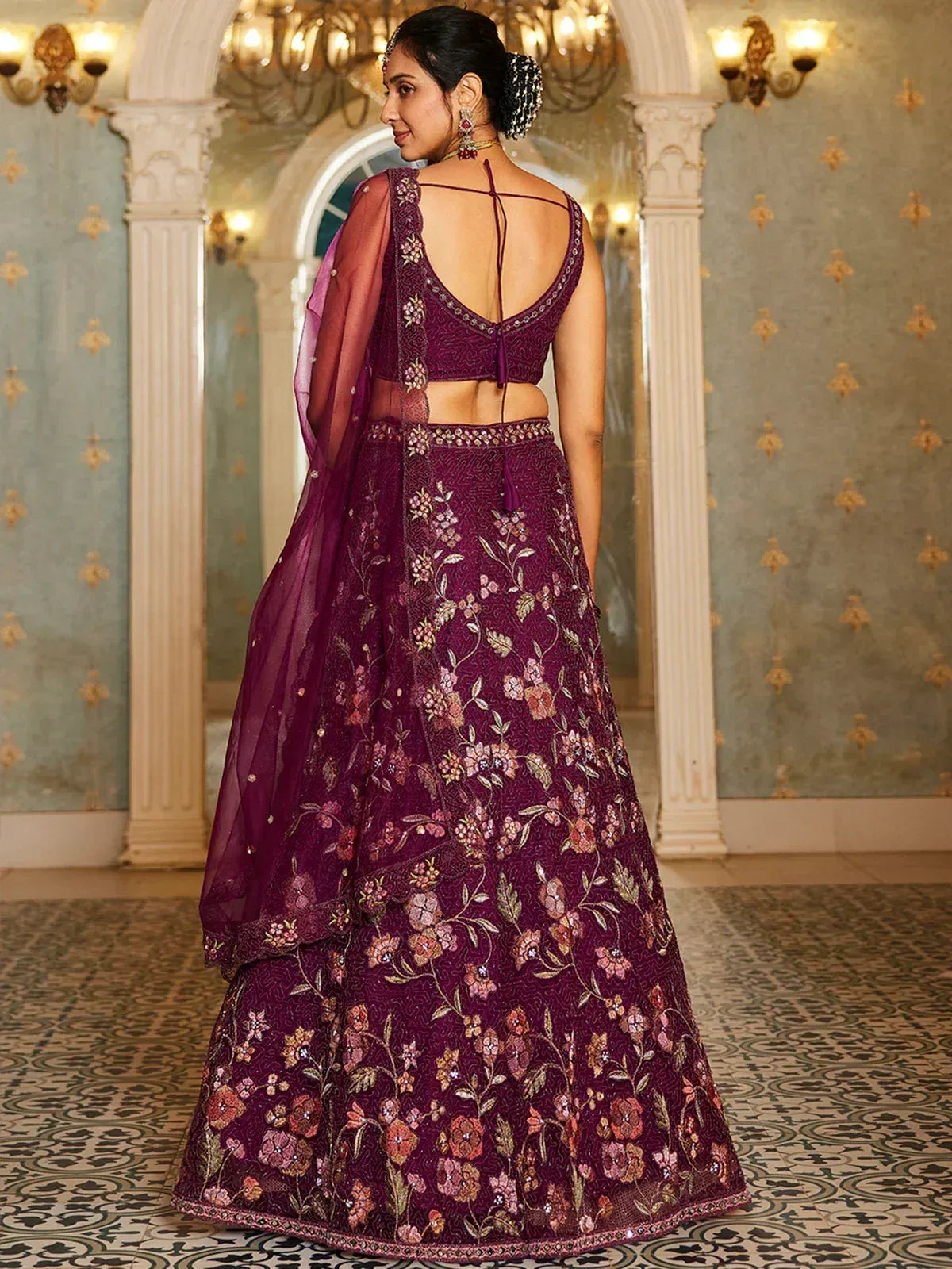 Purple floral embroidered lehenga choli with backless blouse and dupatta, perfect for Indian weddings