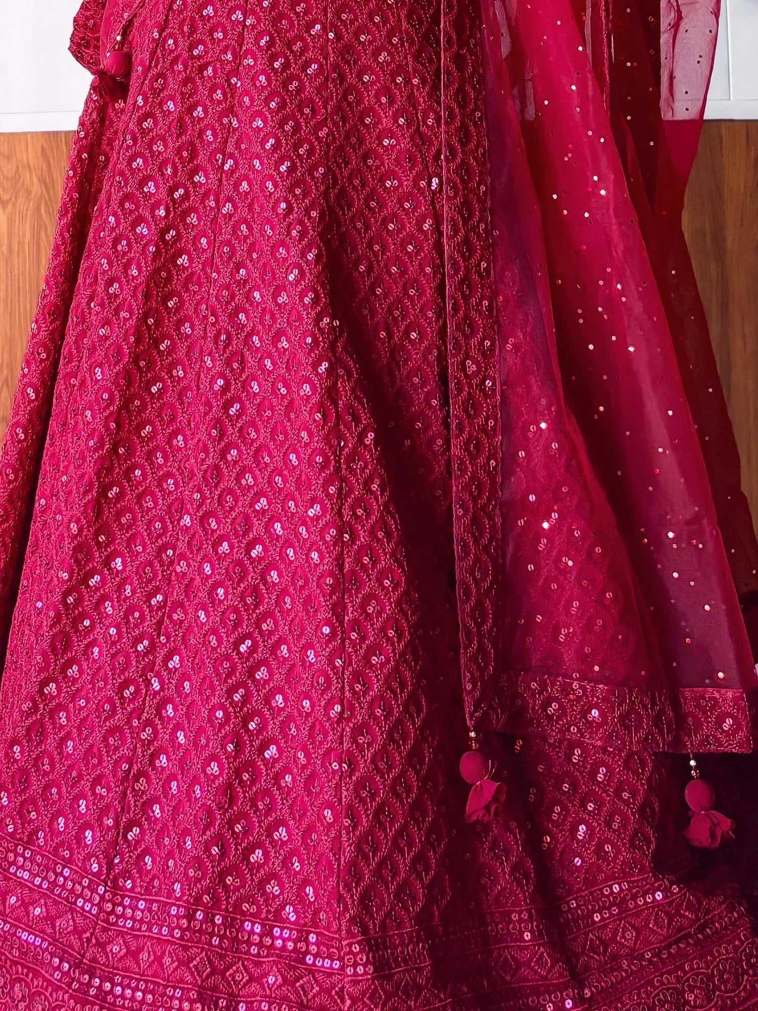 Red embroidered lehenga choli with sequin work and matching dupatta, perfect for Indian ethnic wear occasions