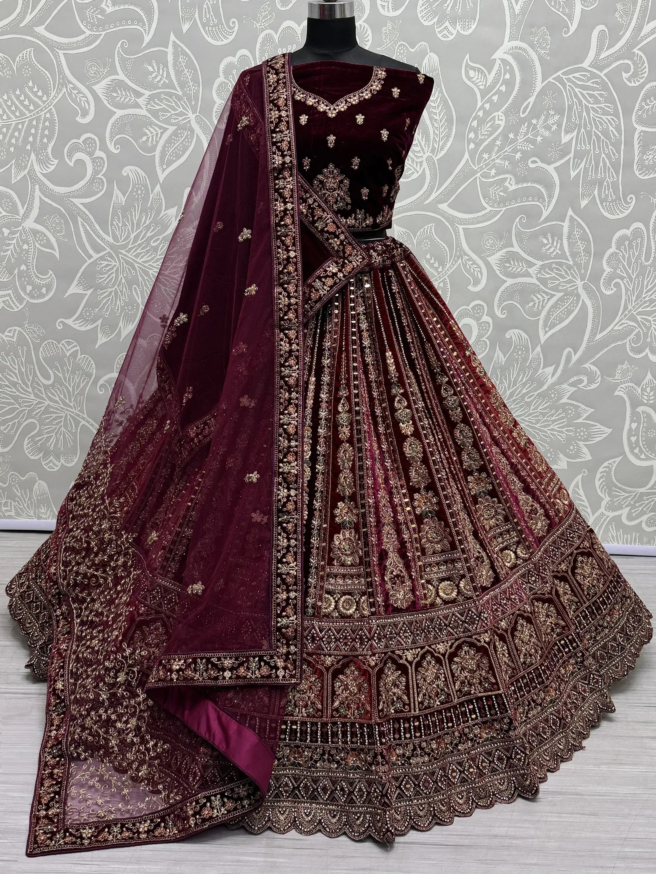 Burgundy velvet lehenga choli with gold embroidery and sheer dupatta, Indian ethnic wear
