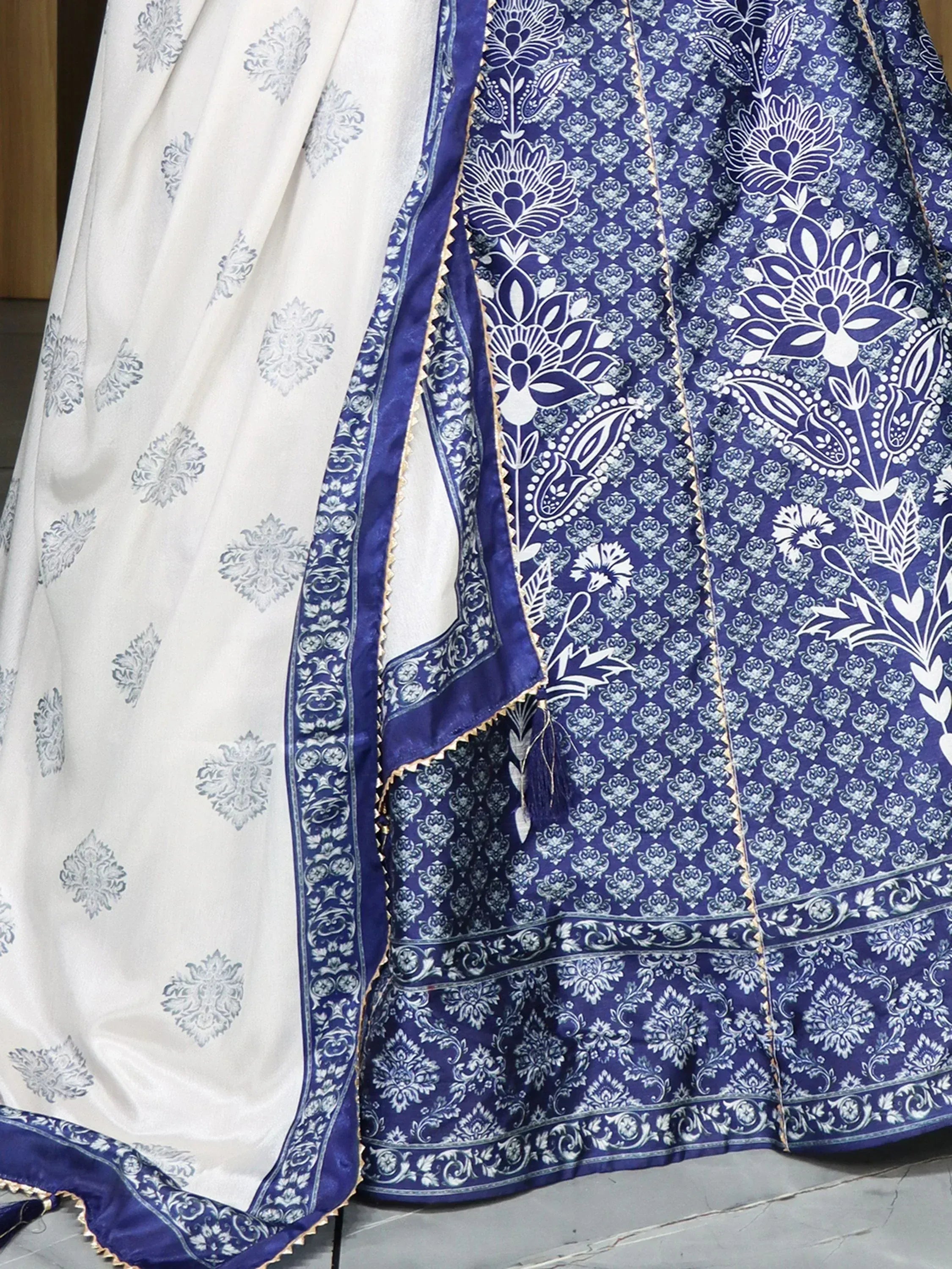 Blue and white printed ethnic lehenga choli with floral motifs and border detailing