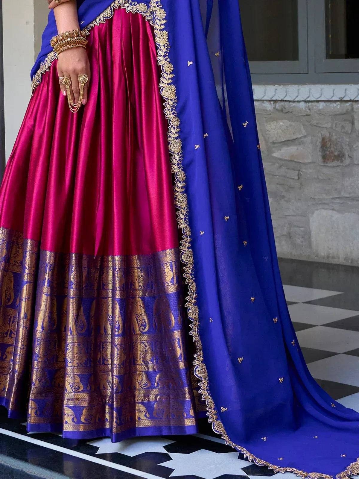 Fuchsia and royal blue lehenga choli with gold elephant border and embroidered dupatta, ethnic Indian wear