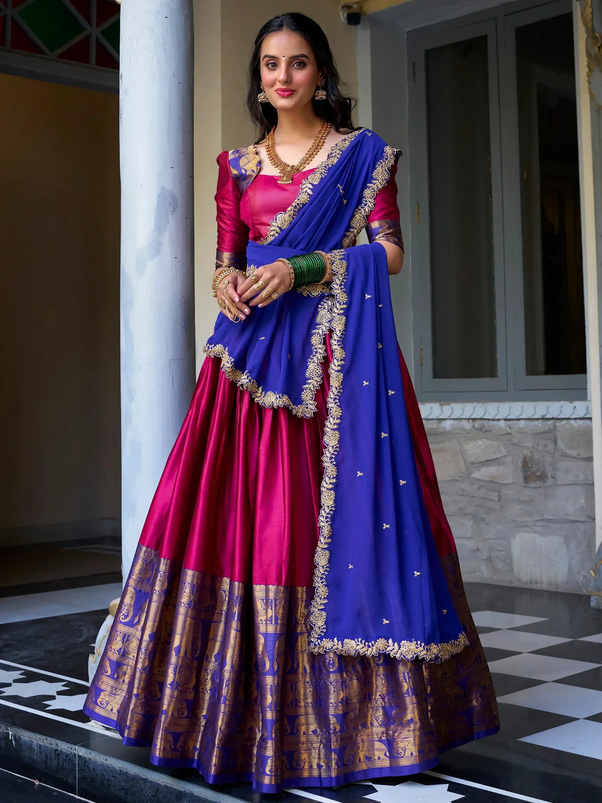 Royal blue and magenta lehenga choli with gold embroidery, perfect for Indian weddings and festivals