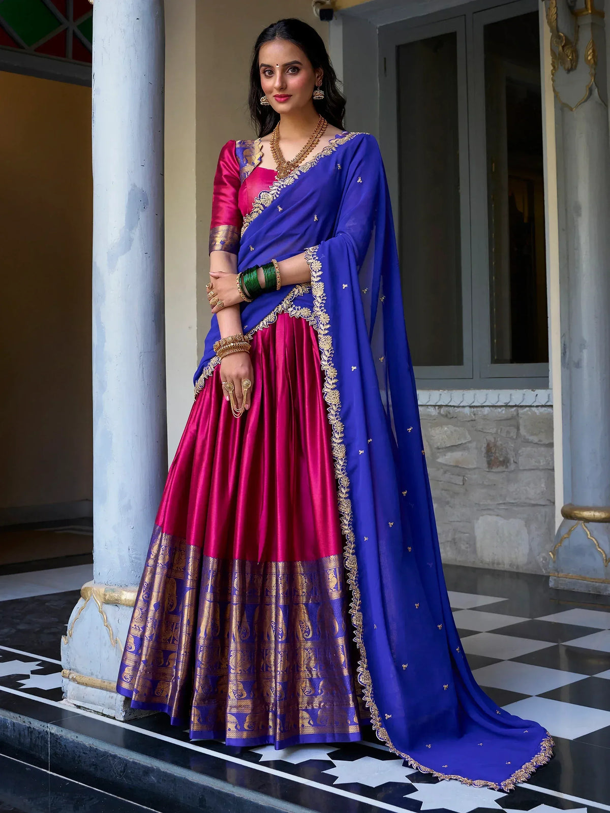 Royal blue and magenta lehenga choli with gold embroidery, perfect for Indian weddings and festive occasions