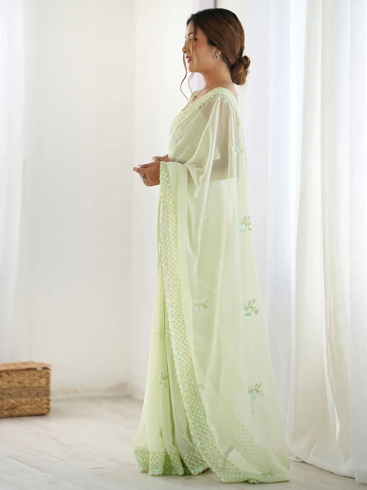 Mint green ethnic gown with sequin embroidery, perfect for Indian weddings or festive occasions.