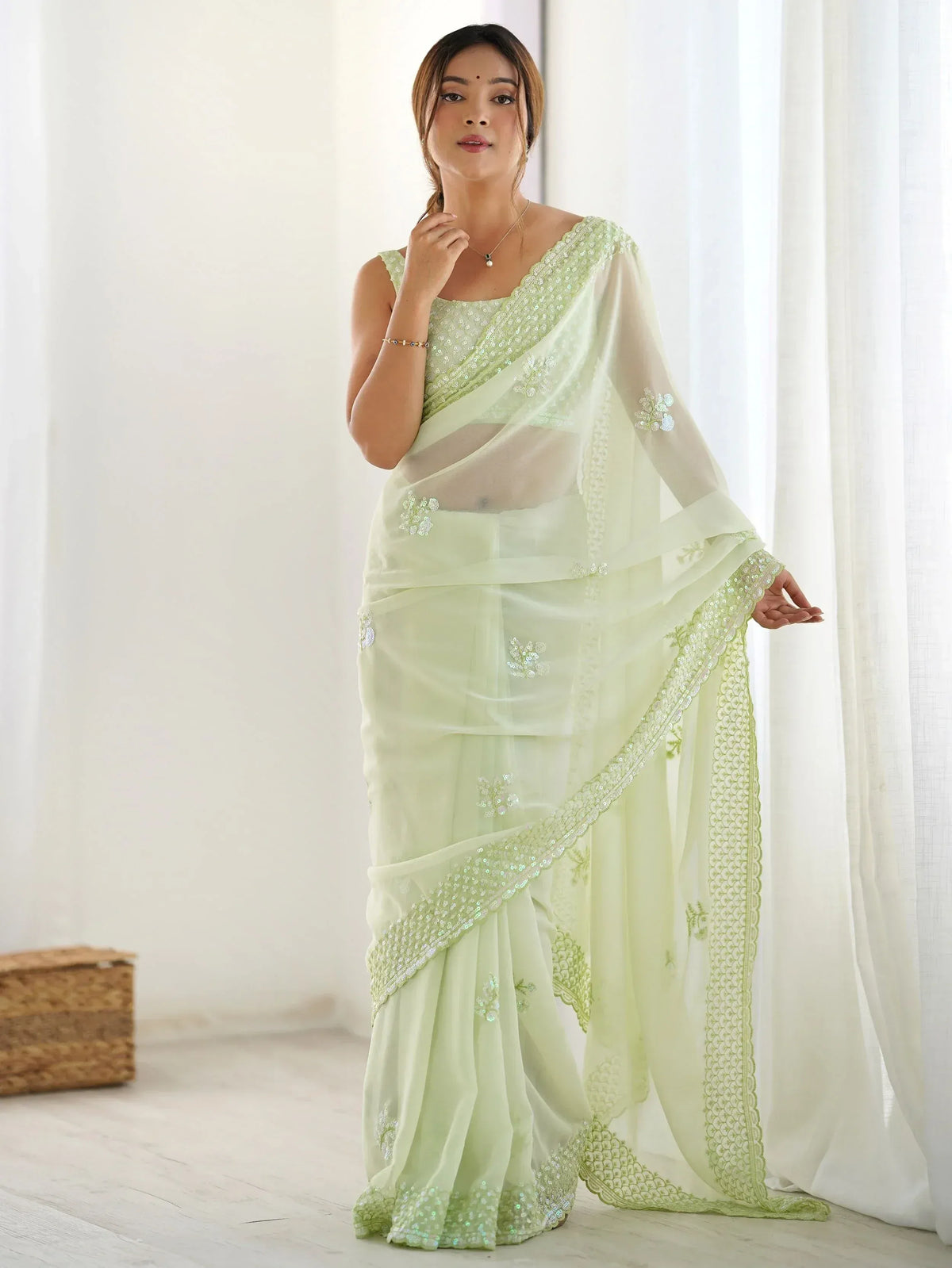 Light green embroidered saree with sequin work, perfect for Indian ethnic occasions