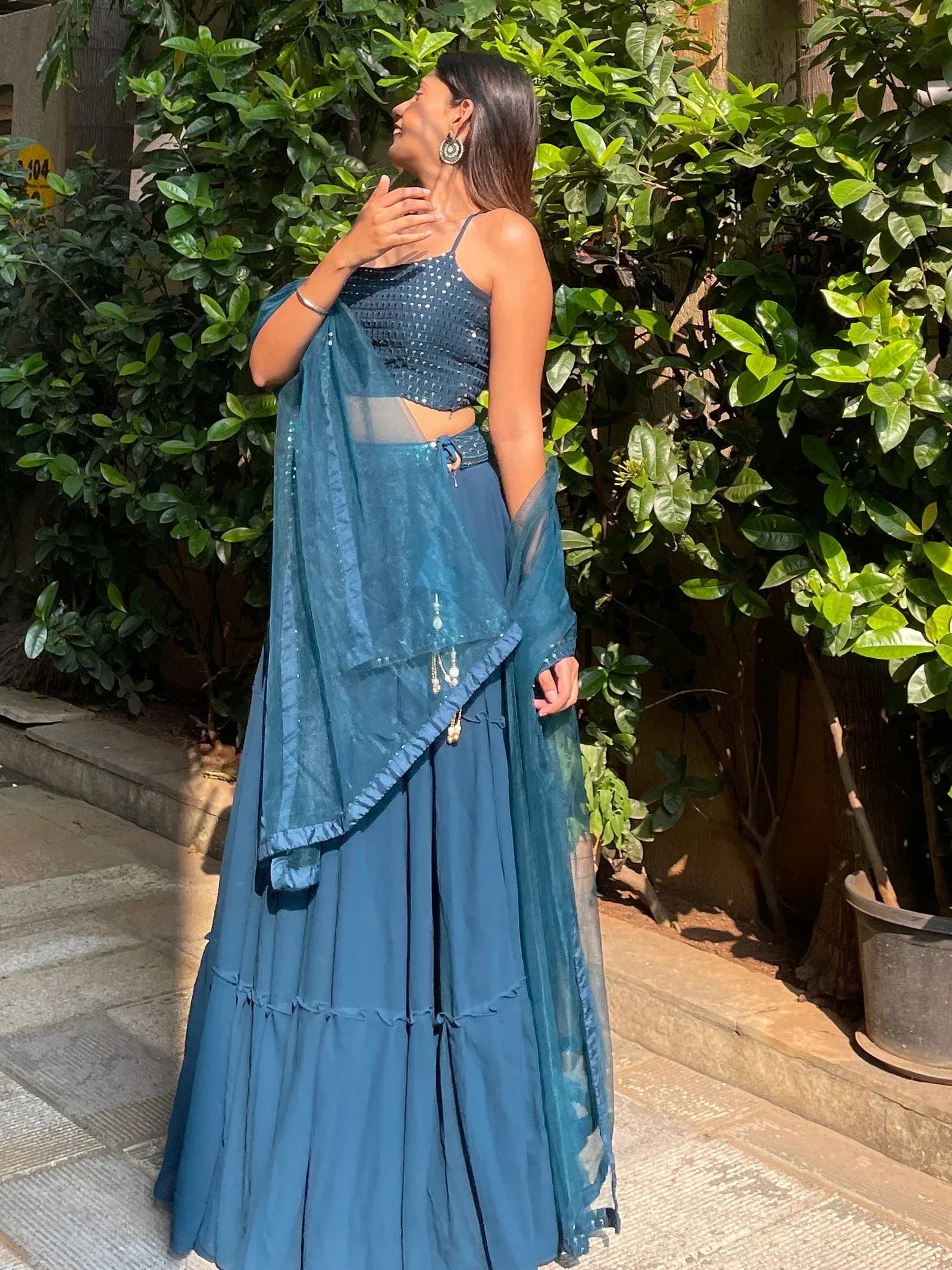 Teal blue sequined lehenga choli with sheer dupatta, perfect for Indian ethnic wear events