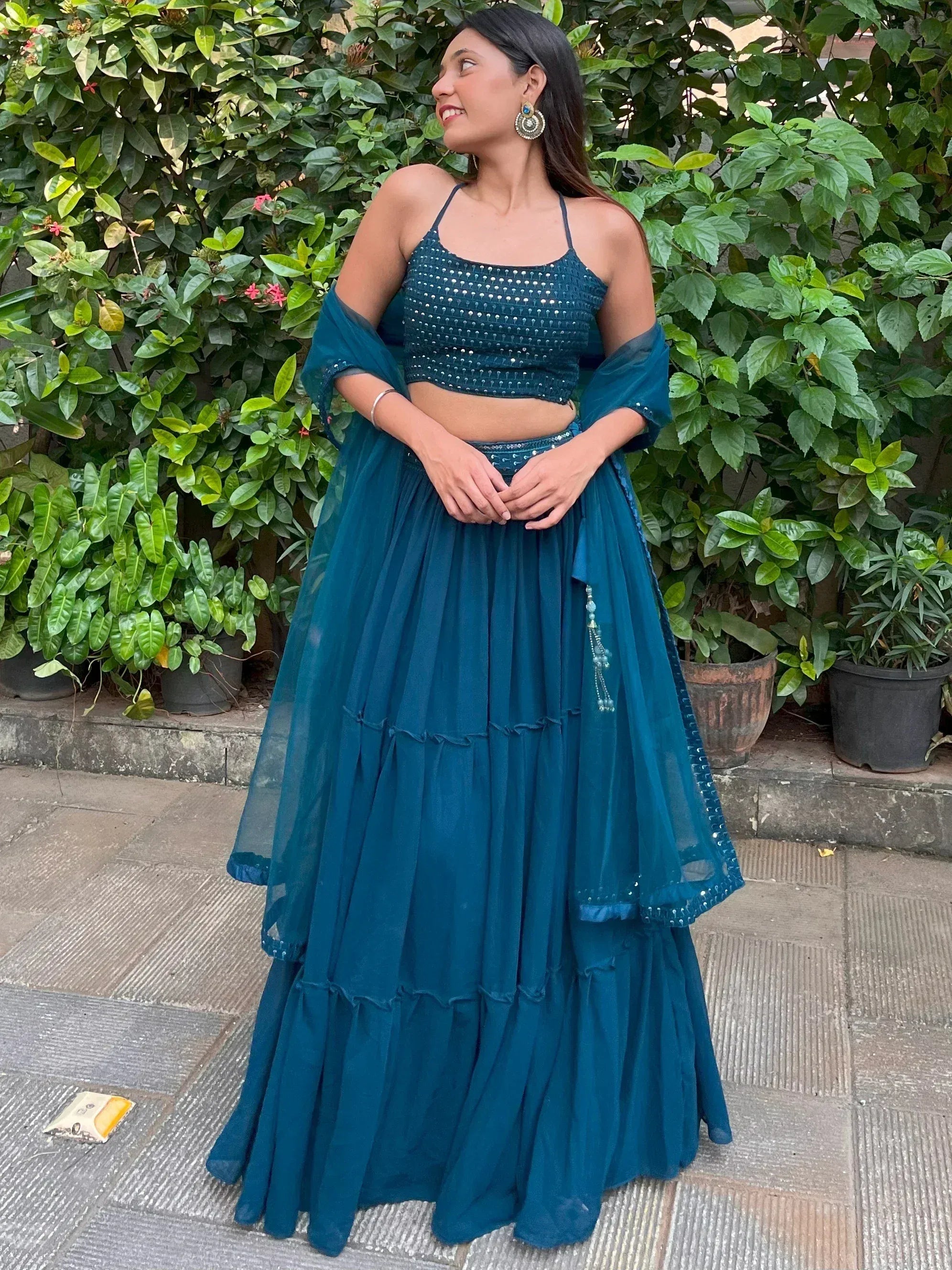 Teal blue embroidered lehenga choli with layered skirt and sheer dupatta, perfect for Indian ethnic occasions