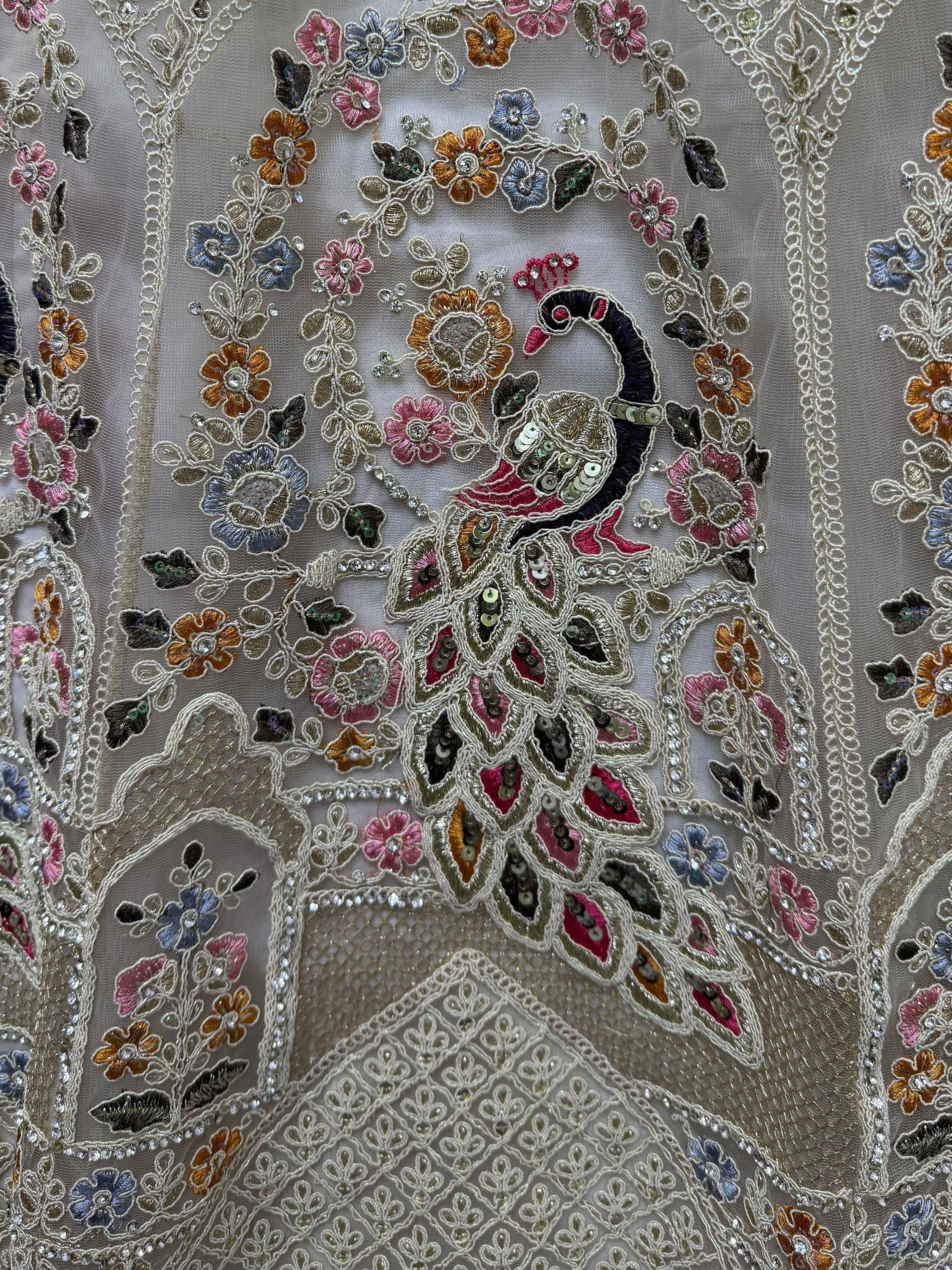 Peacock and floral embroidery on ethnic wear fabric with sequins and beads
