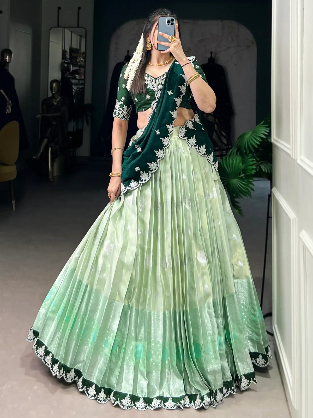 Emerald green embroidered lehenga choli with floral detailing, perfect for Indian ethnic wear occasions