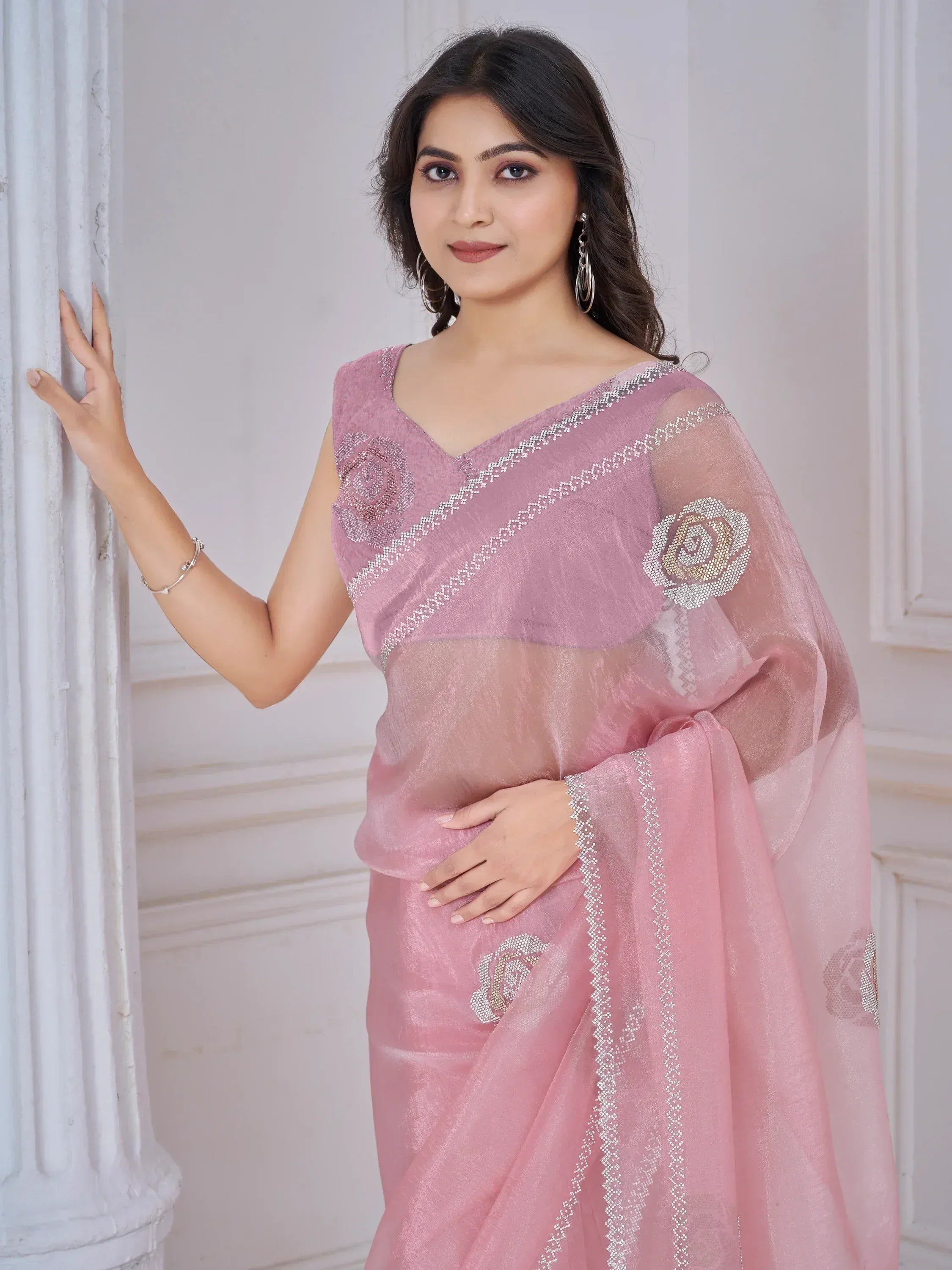 Pink embroidered saree with floral embellishments, perfect for Indian ethnic wear occasions