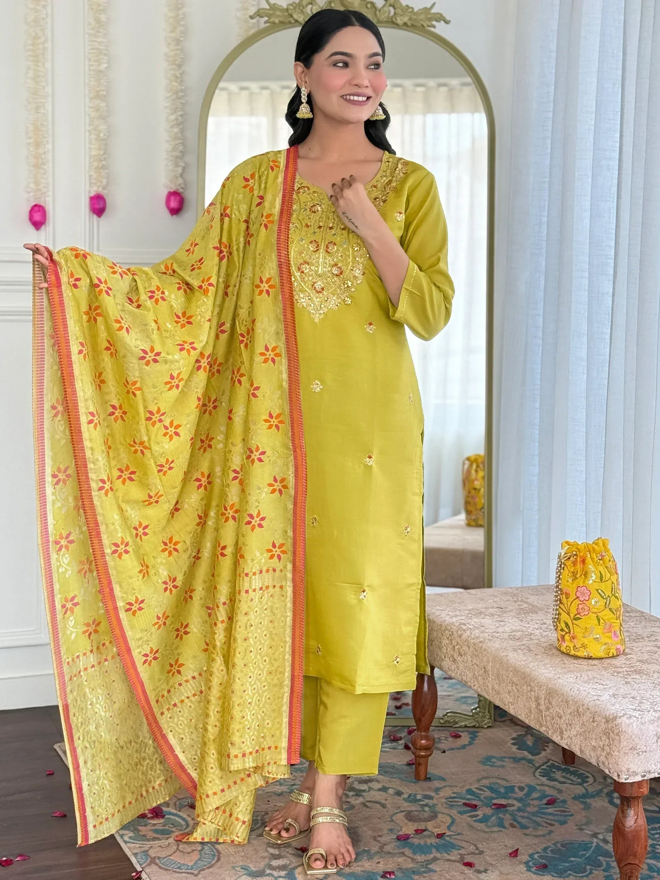 Yellow embroidered kurta set with floral dupatta, perfect for festive occasions and ethnic wear.