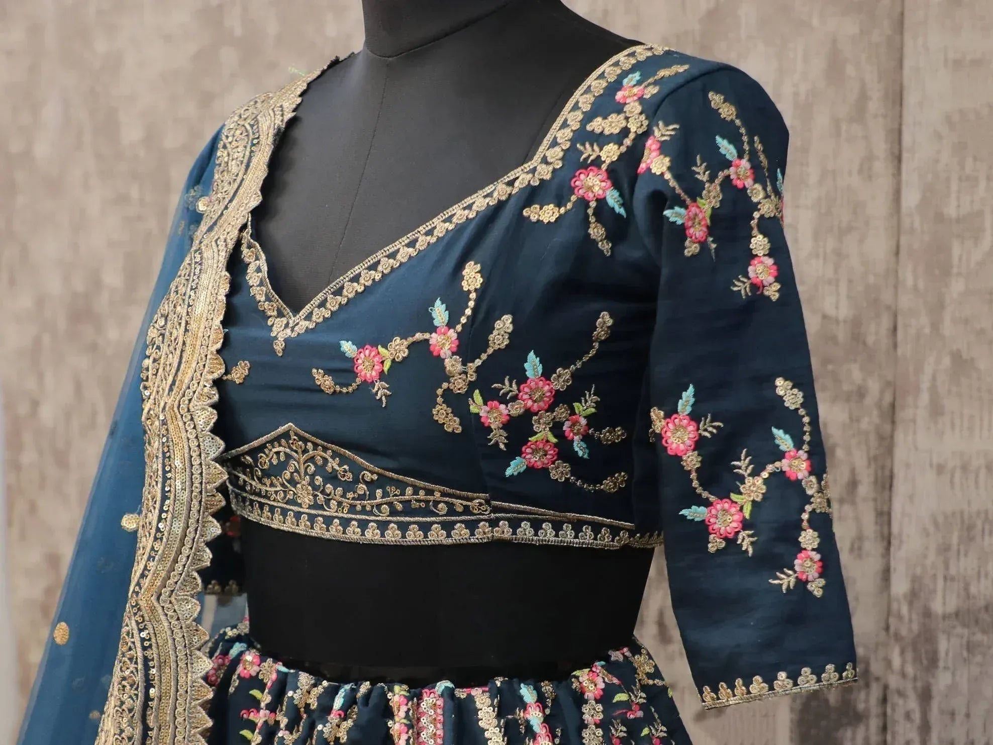 Dark blue embroidered lehenga choli with floral gold detailing and matching dupatta