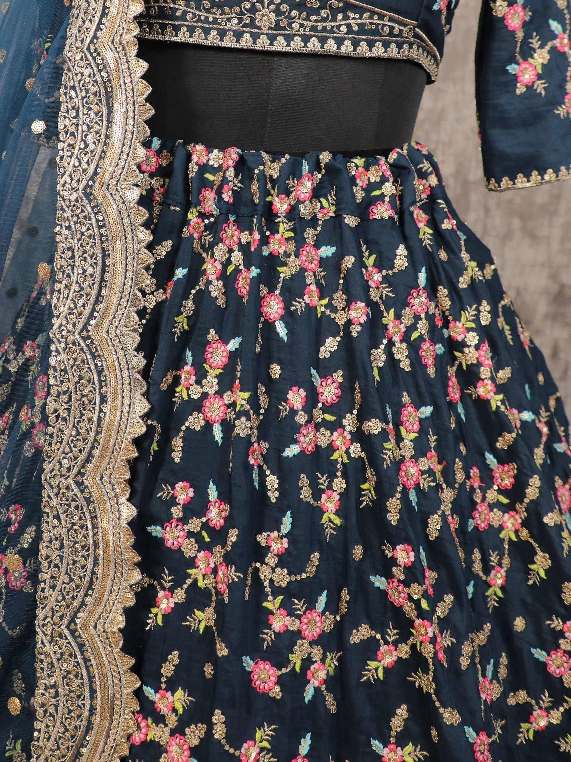 Dark blue lehenga choli with pink floral embroidery and gold zari work, perfect for Indian ethnic wear