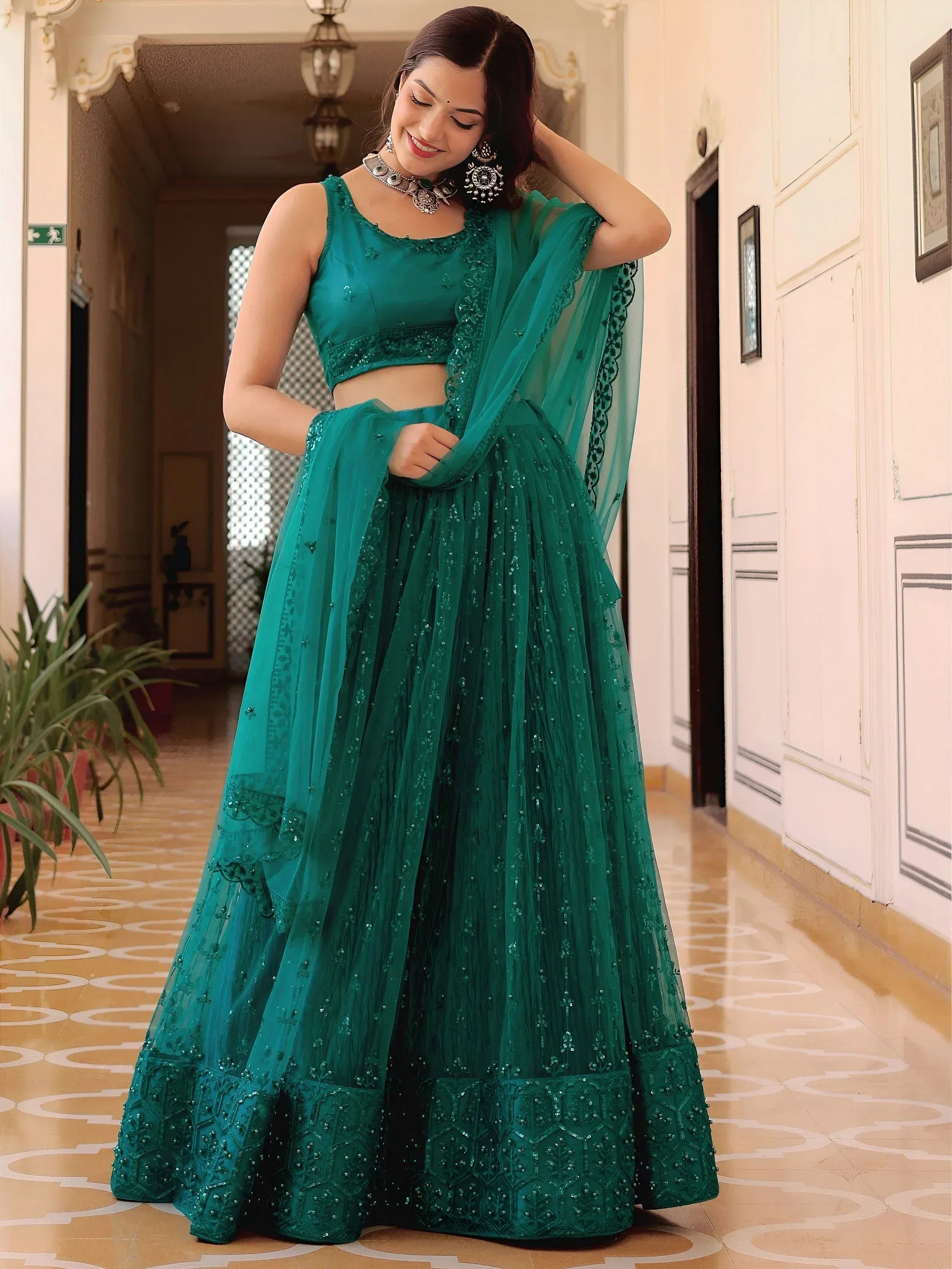 Emerald green designer lehenga choli with sequin embroidery and sheer dupatta for Indian ethnic wear