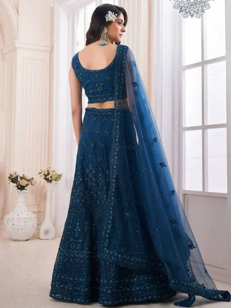 Elegant navy blue embroidered lehenga choli with sheer dupatta, perfect for Indian ethnic occasions