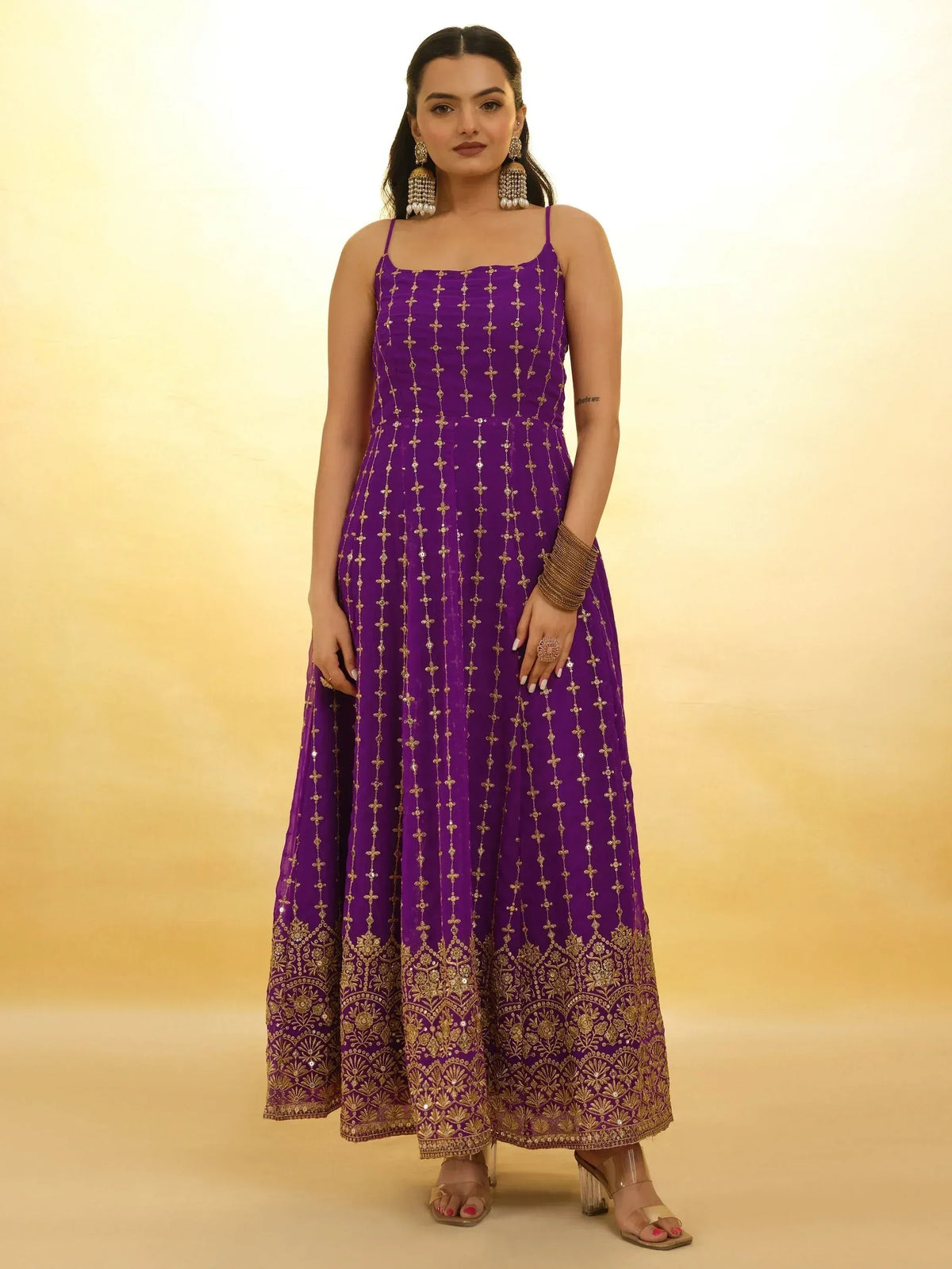 Purple ethnic gown with gold embroidery, perfect for Indian occasions and festive wear