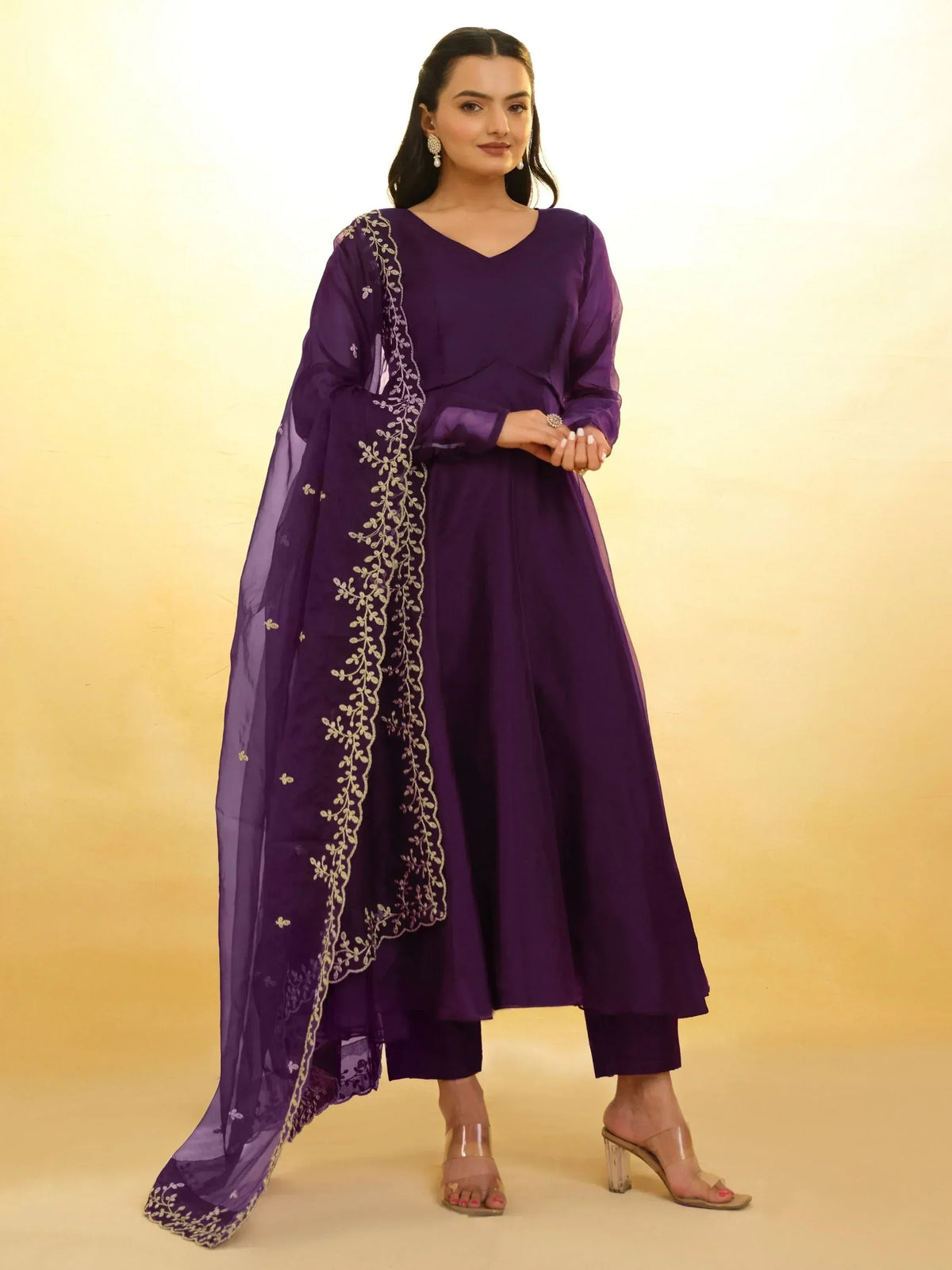 Purple ethnic anarkali suit with gold embroidery and sheer dupatta, perfect for Indian occasions