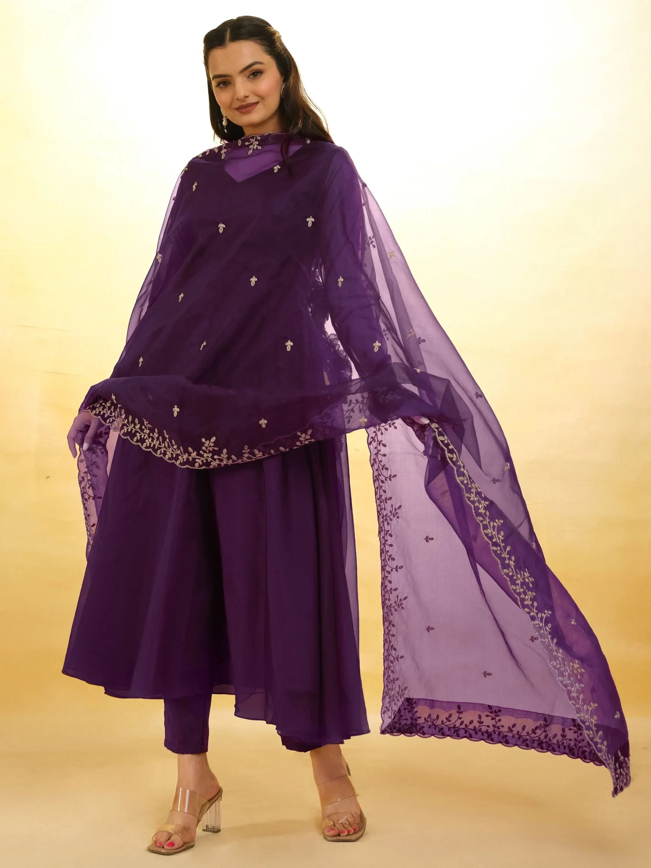 Woman wearing a purple embroidered salwar kameez and dupatta, Indian ethnic suit