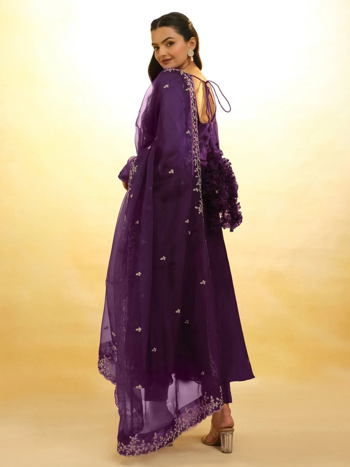 Purple embroidered ethnic gown with sheer dupatta, ruffled sleeves, and open back design for women