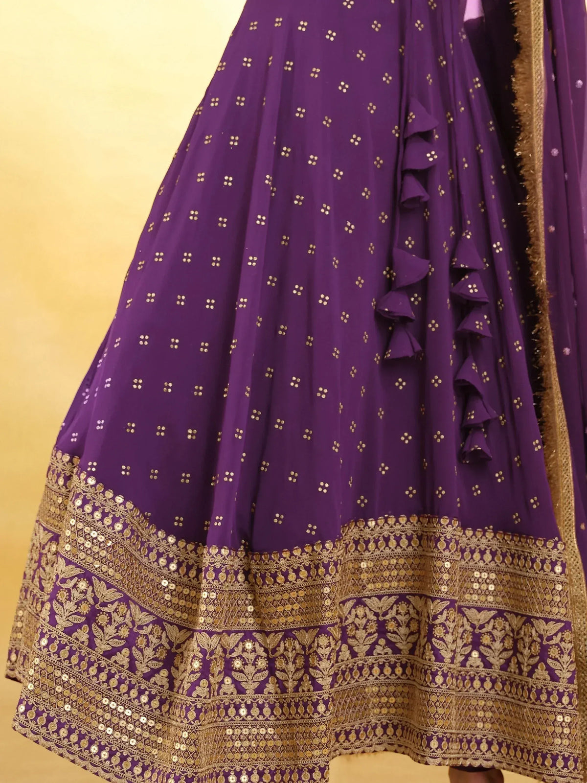 Purple designer lehenga with gold embroidery and ruffle details, ethnic Indian wear