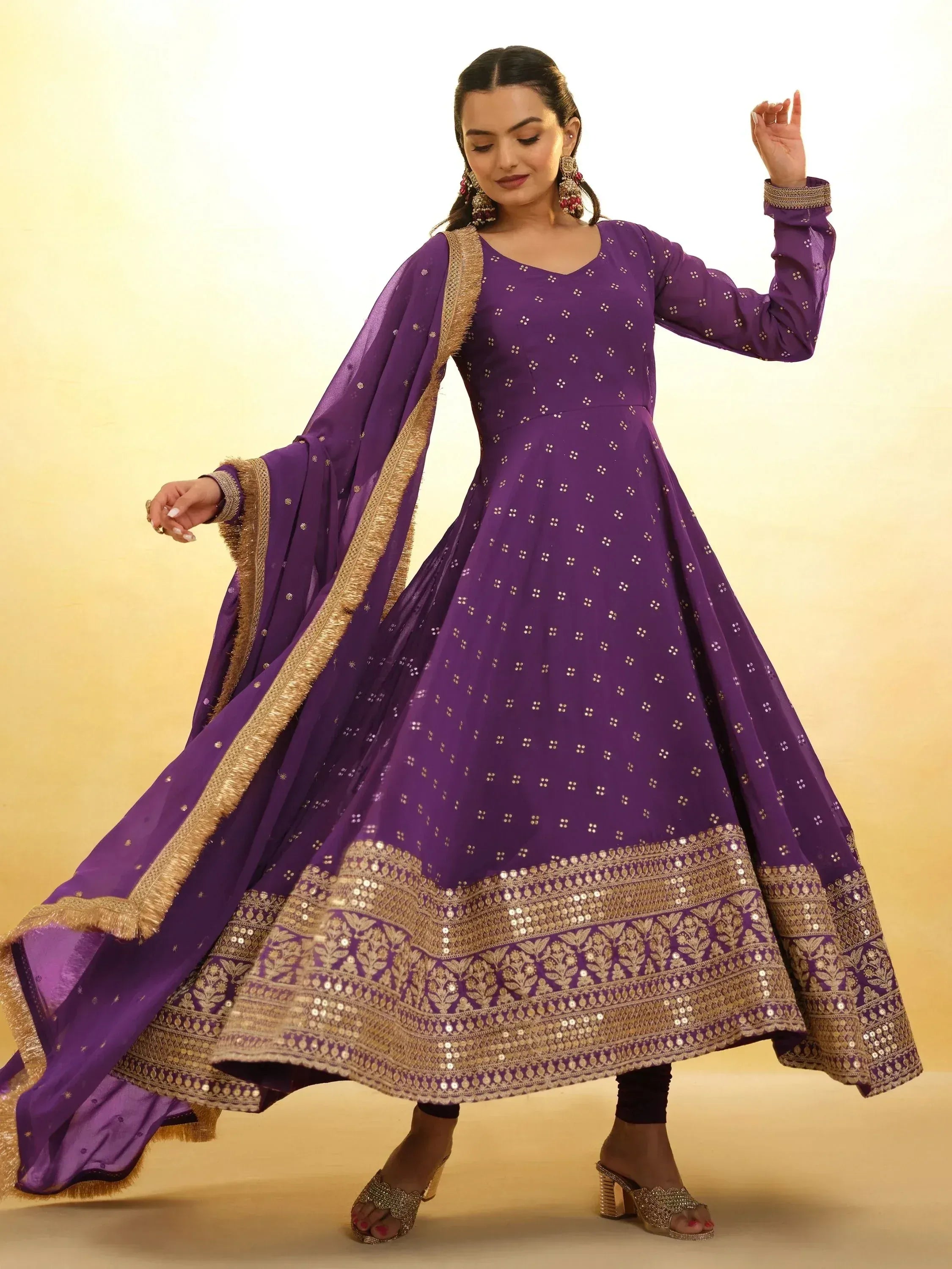 Purple ethnic anarkali suit with gold embroidery and sequins, perfect for Indian festive occasions