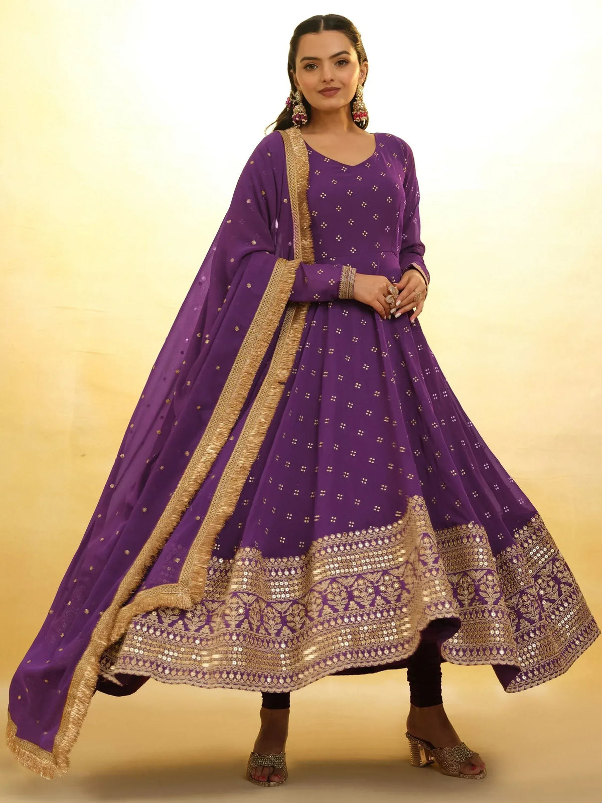 Purple ethnic anarkali with gold embroidery and dupatta, perfect for Indian weddings and festivals