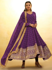 Woman in purple embroidered ethnic gown with gold dupatta, designer Indian wear at Ethnic Plus