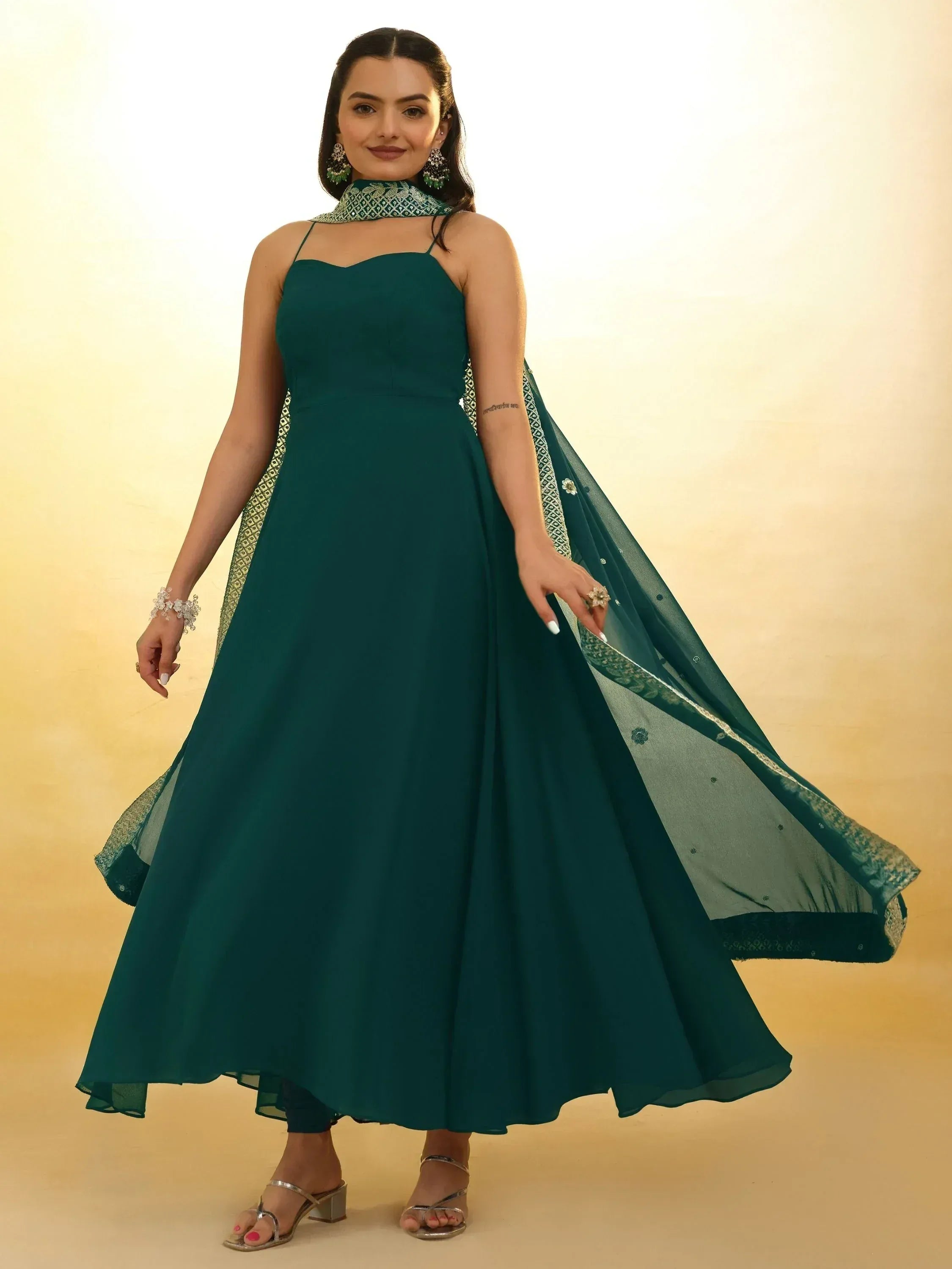 Emerald green ethnic gown with embellished dupatta, perfect for Indian weddings and festive occasions.